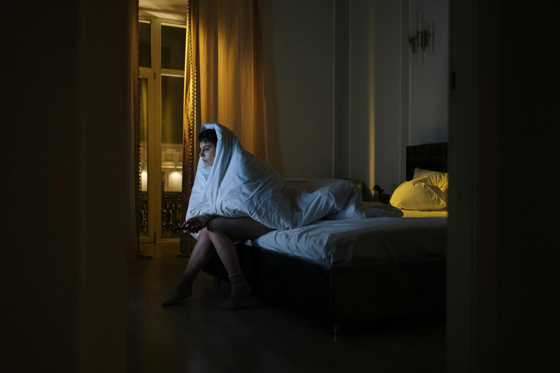 Person choosing TV over sleep 