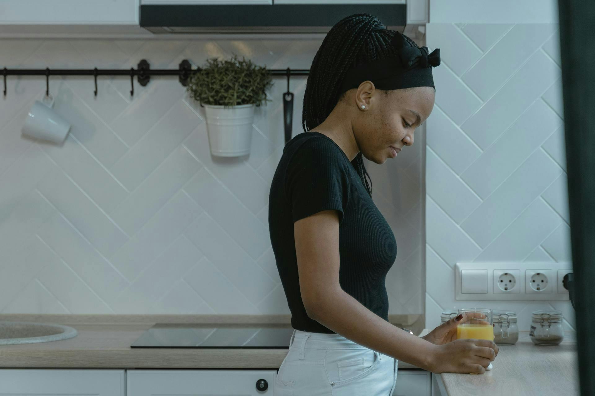 Person drinking pineapple juice post workout