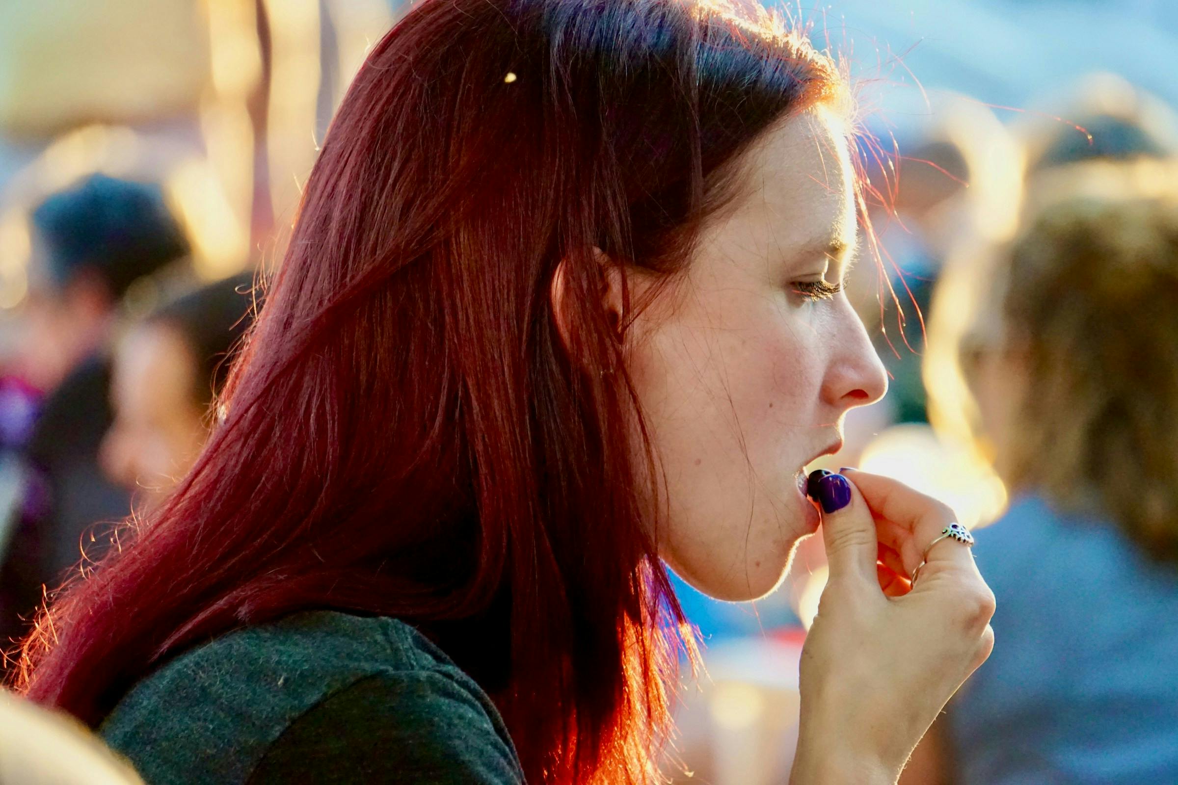 Lady taking cranberry supplement