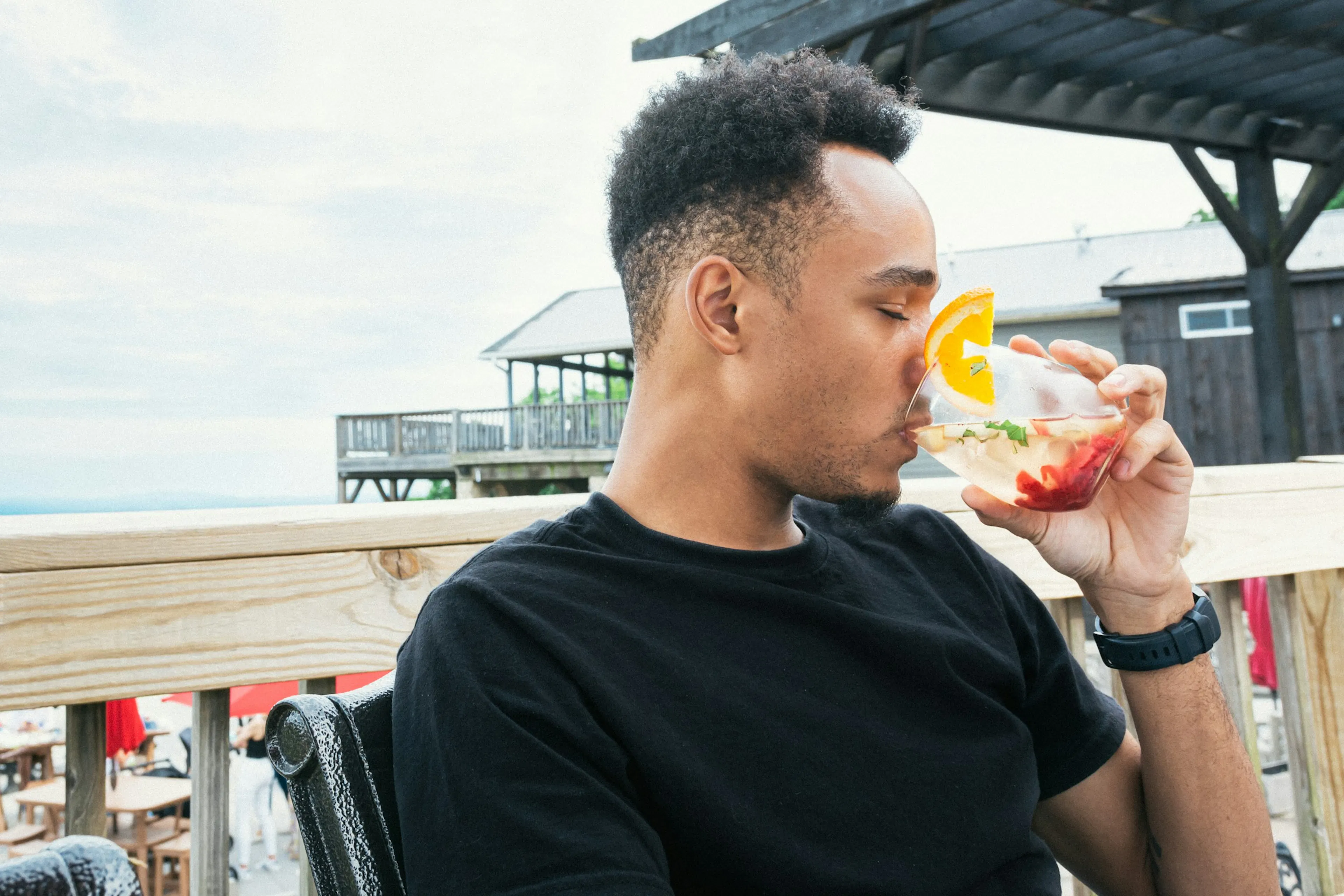 Guy taking cranberry juice to help lower blood pressure and support heart health.