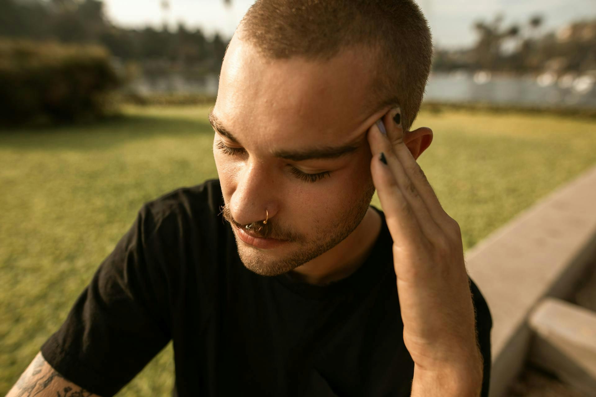 A young man feeling headache