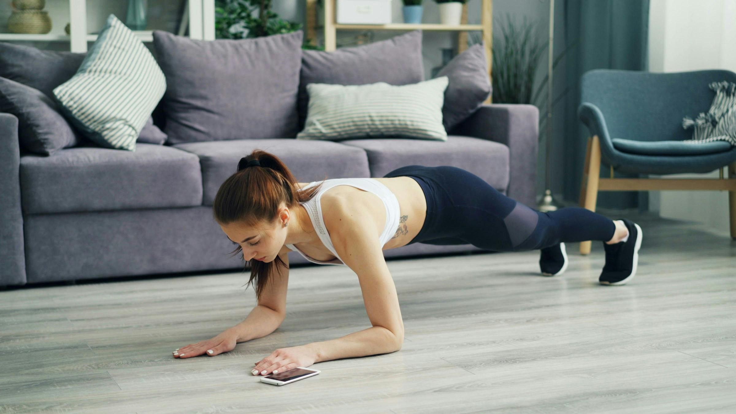 Woman planking at home