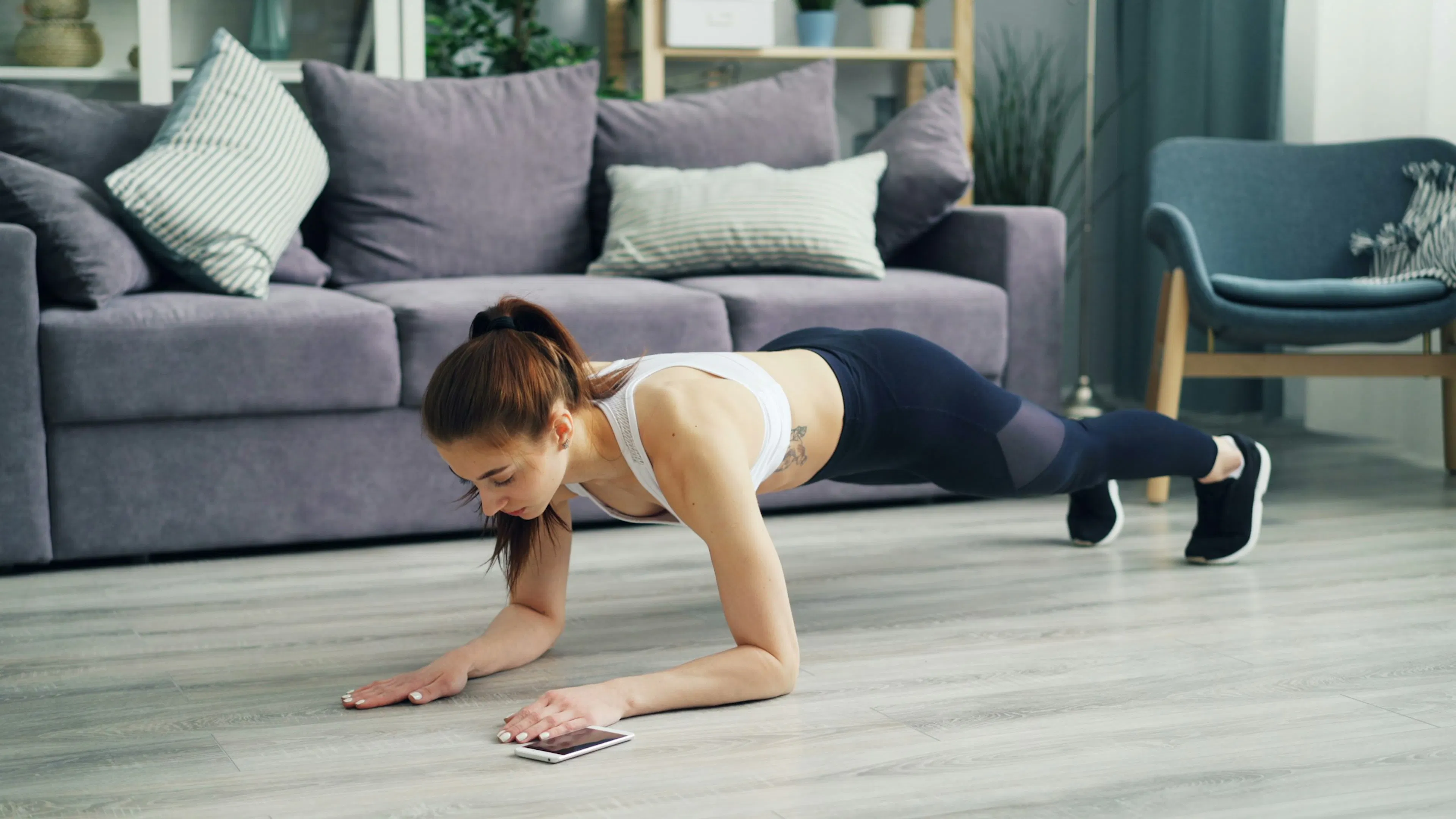 Woman planking at home