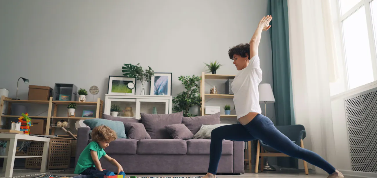 Woman doing lunges for cardio workout at home