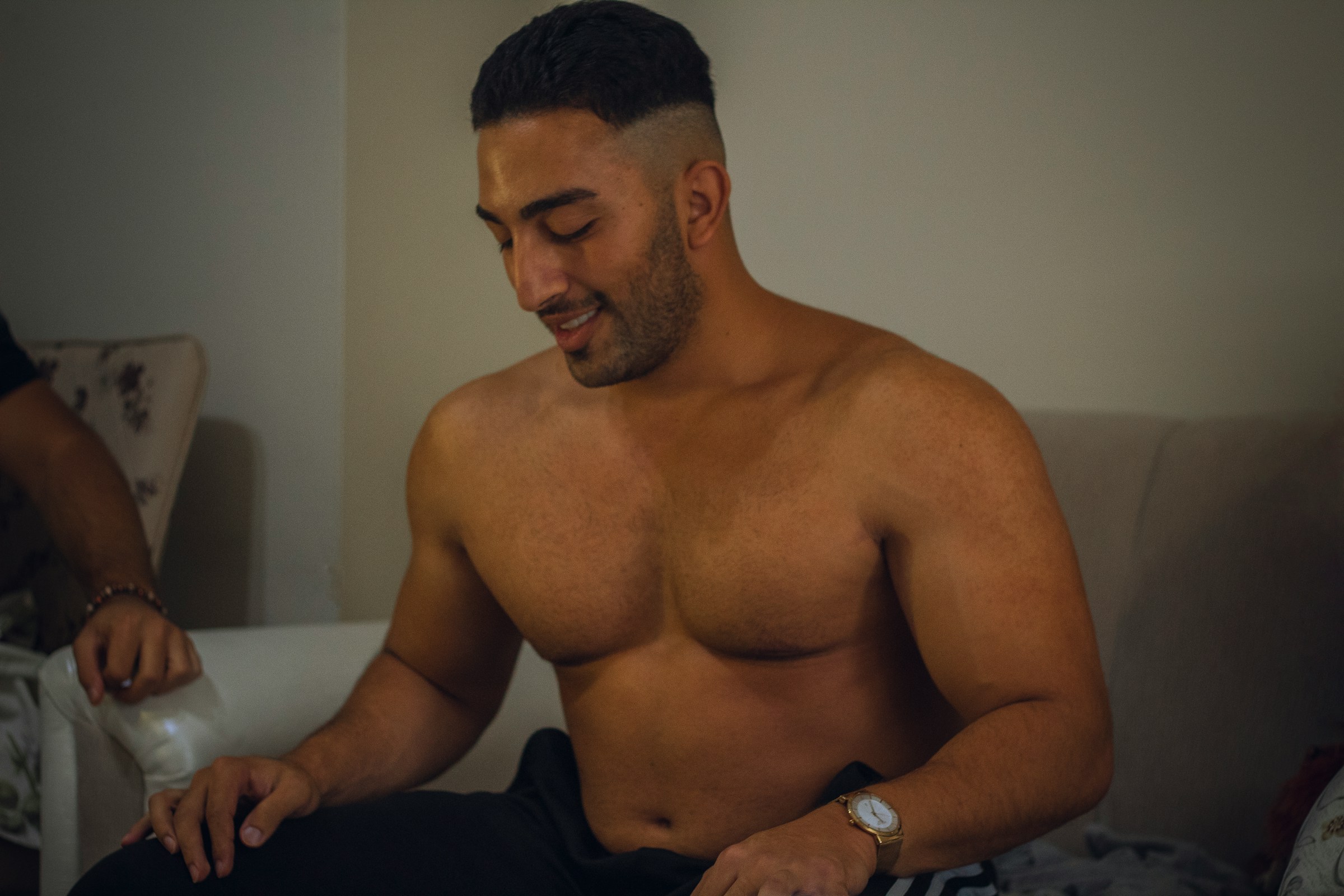 Man checking weight scale after starting testosterone therapy