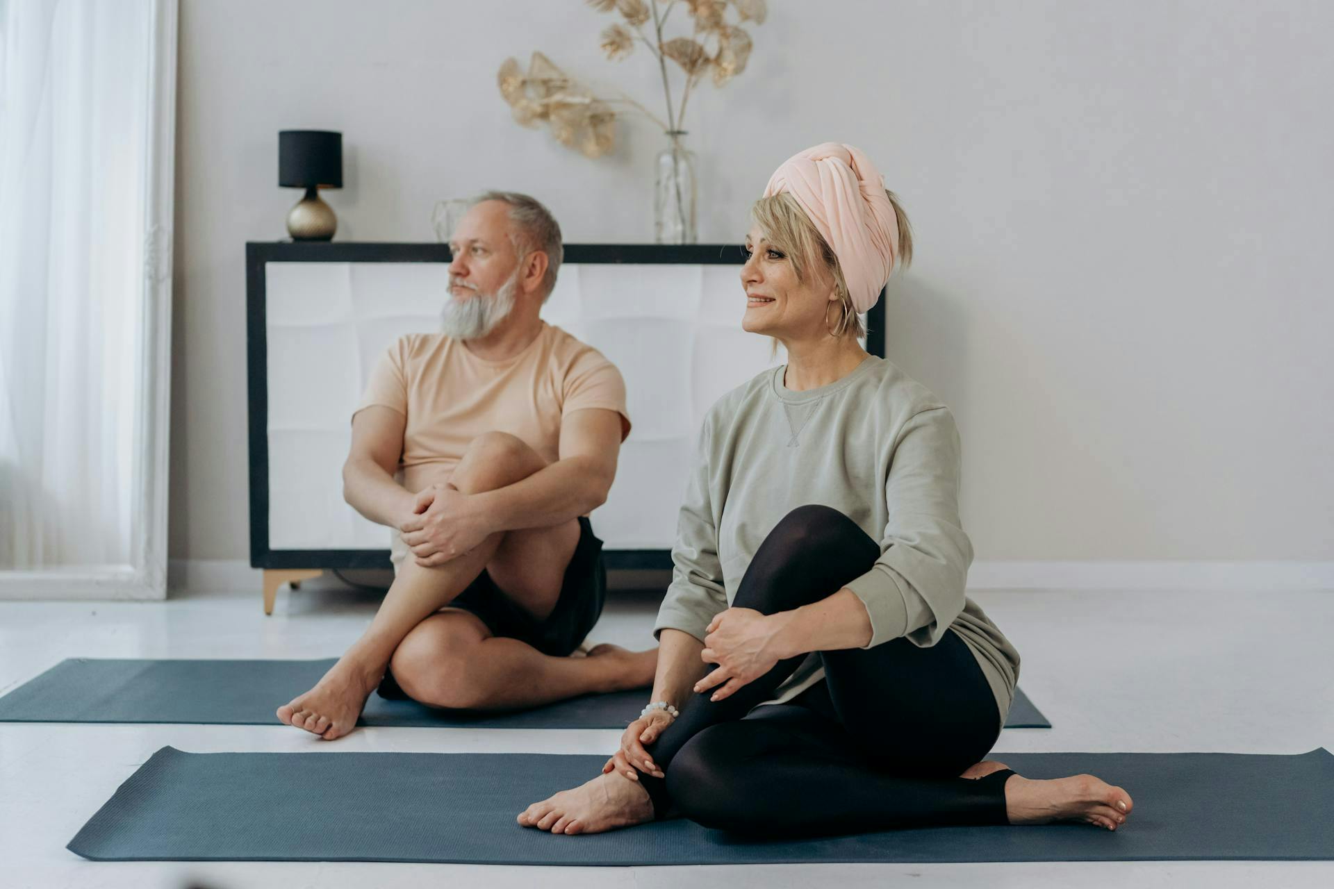 Couple stretching as part of fat-burning fitness routine