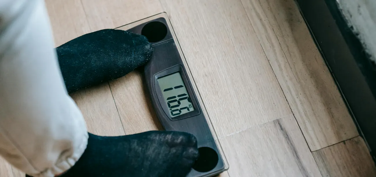 A person checking their weight