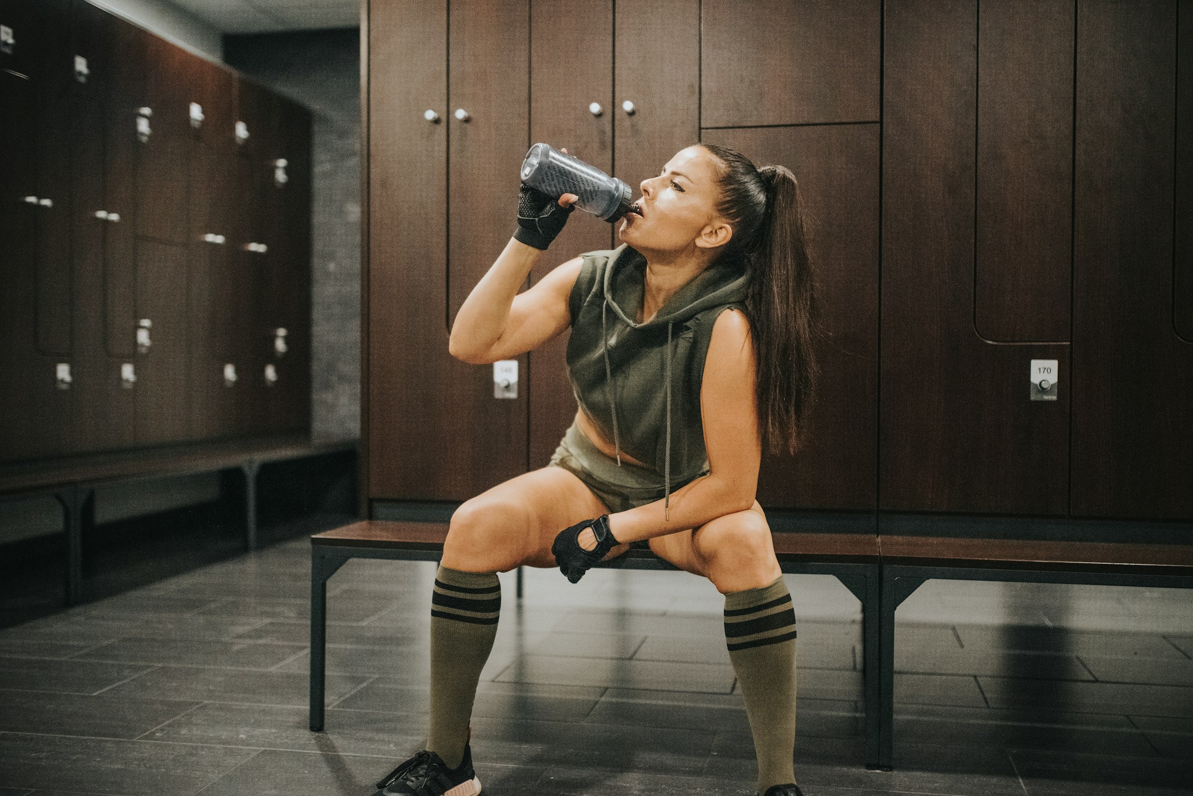 Lady taking creatine post-workout