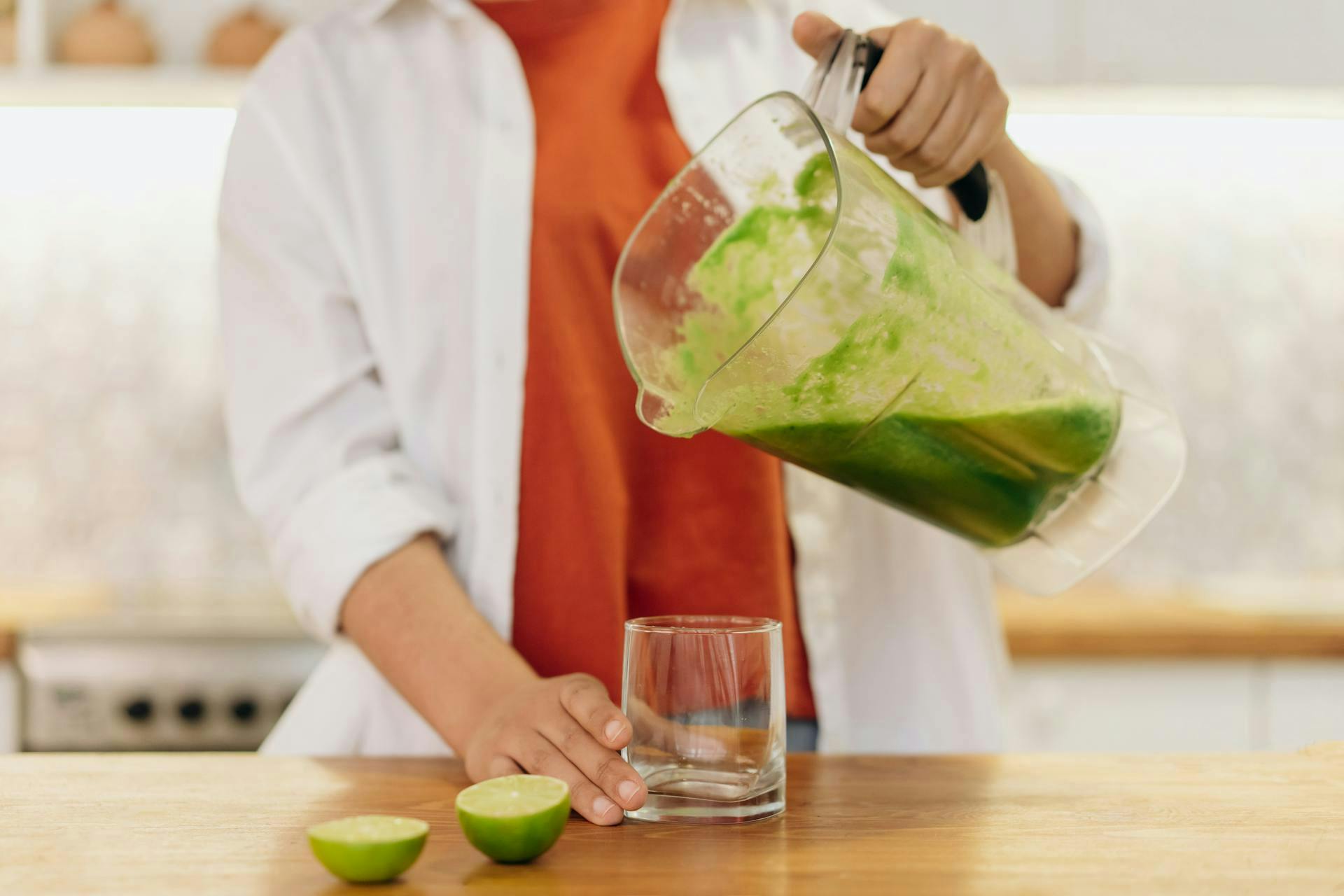 Green juice in glass with fresh fruits and vegetables for weight loss