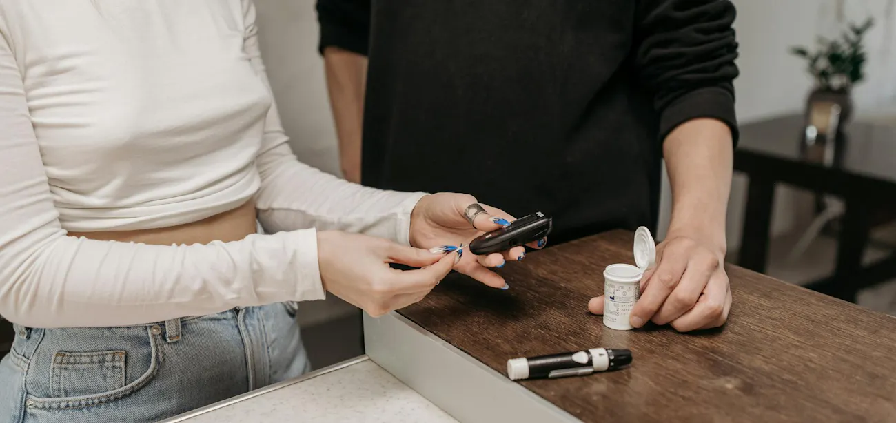 Person checking blood sugar levels at home