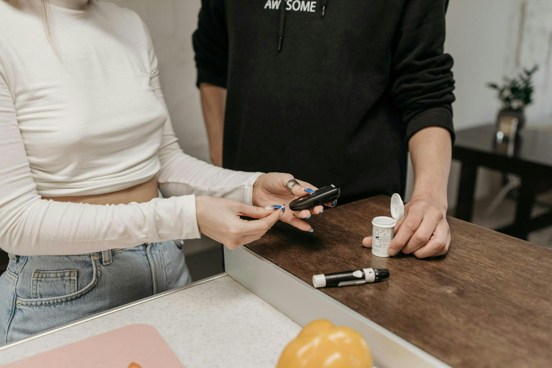 Person checking blood sugar levels at home