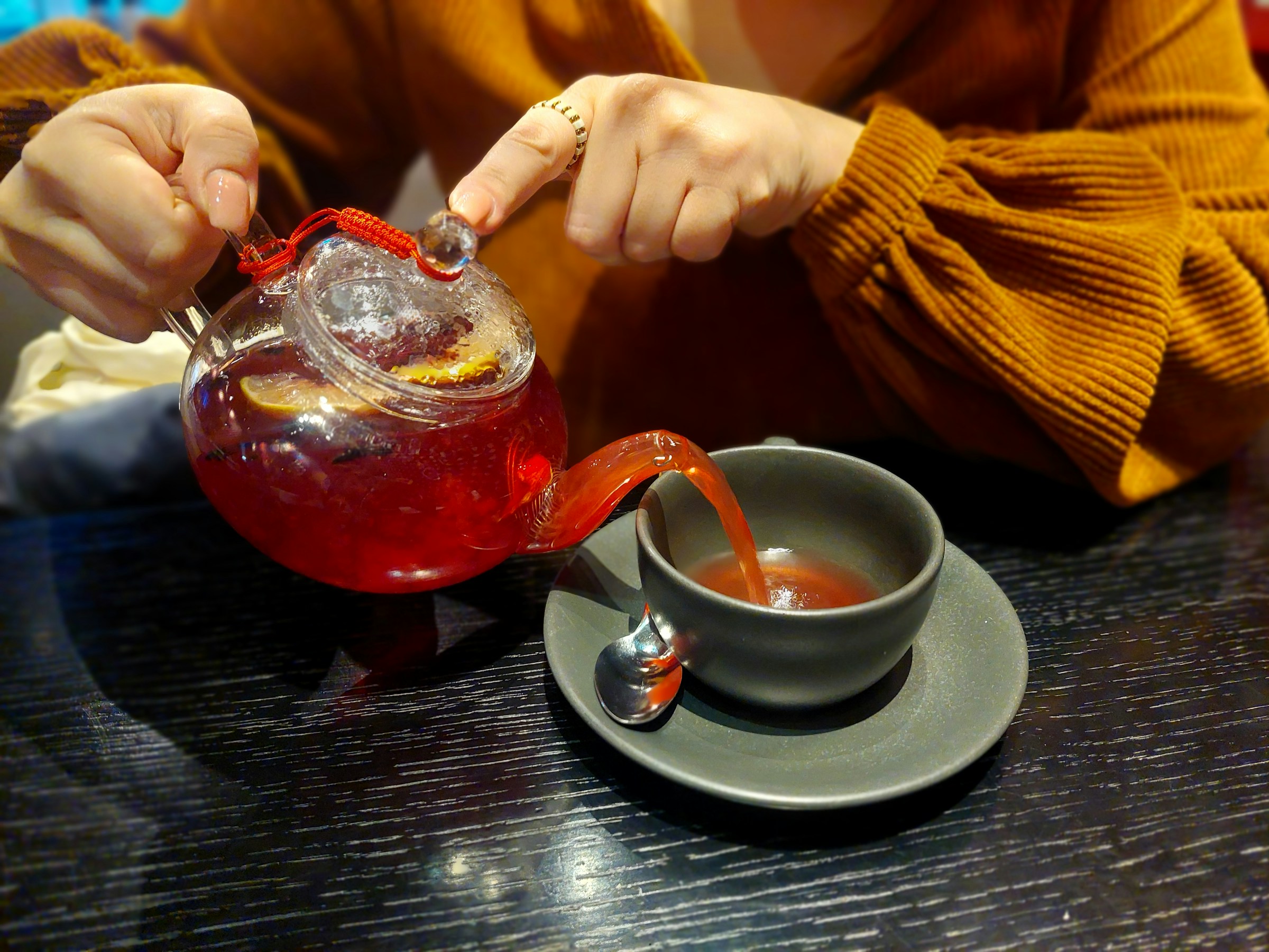 Person drinking cherry juice before bedtime for better sleep