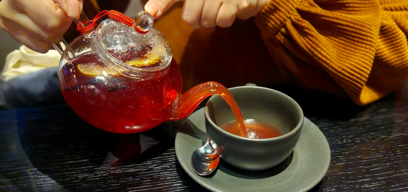 Person drinking cherry juice before bedtime for better sleep