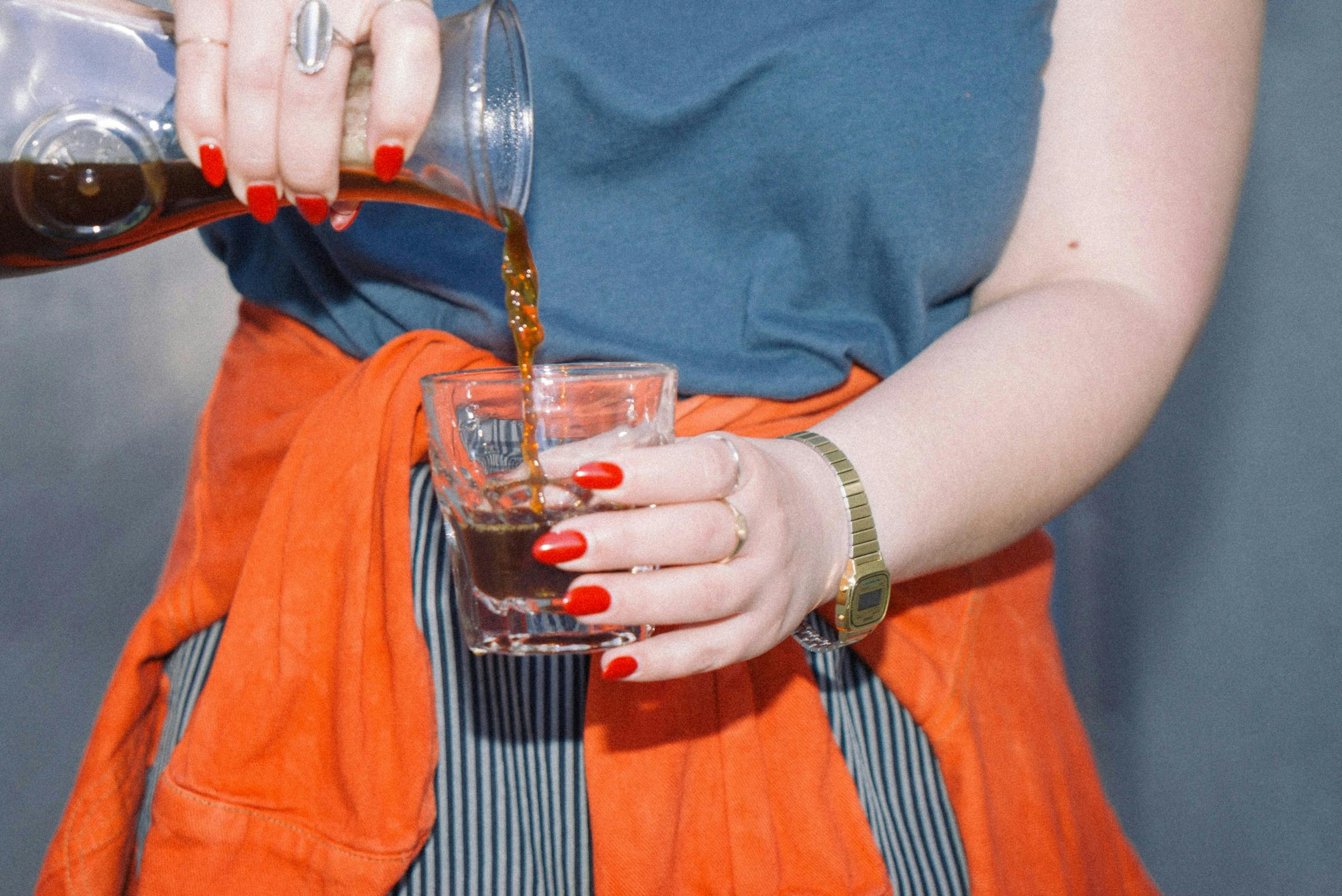 Tart cherries and juice in a clear glass