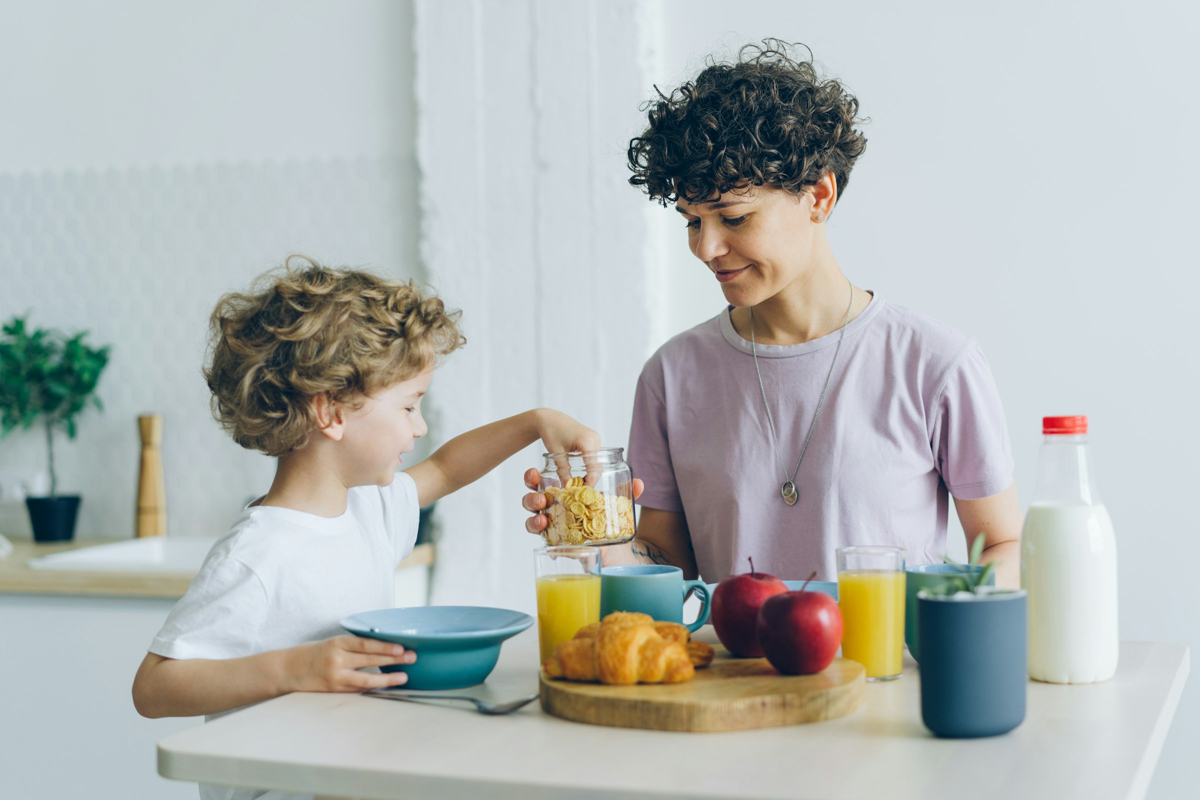 A child with a Bowl of colorful breakfast cereal with milk