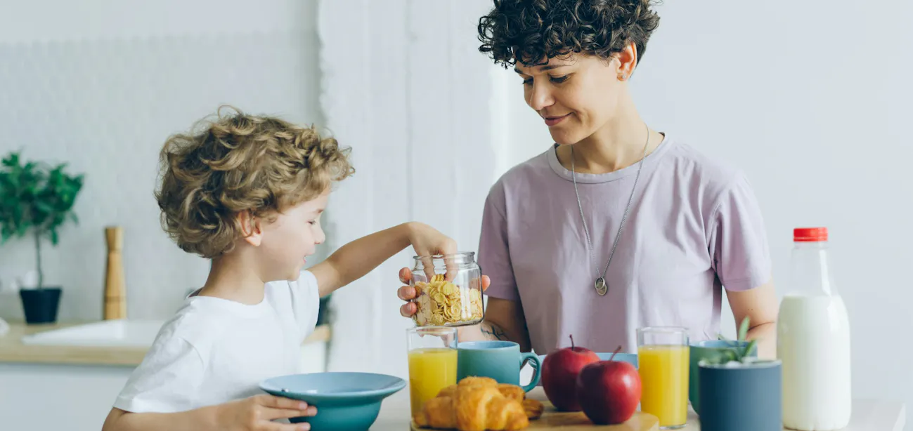 A child with a Bowl of colorful breakfast cereal with milk