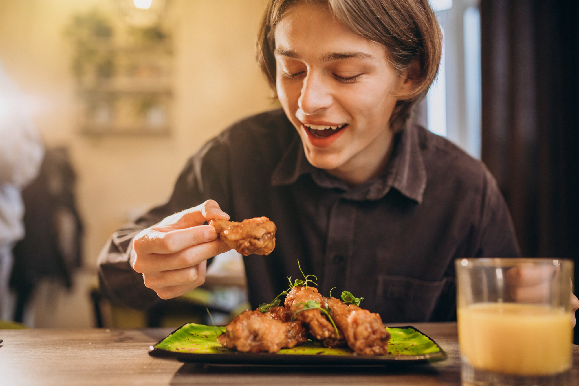 A person eating chicken instead of beef