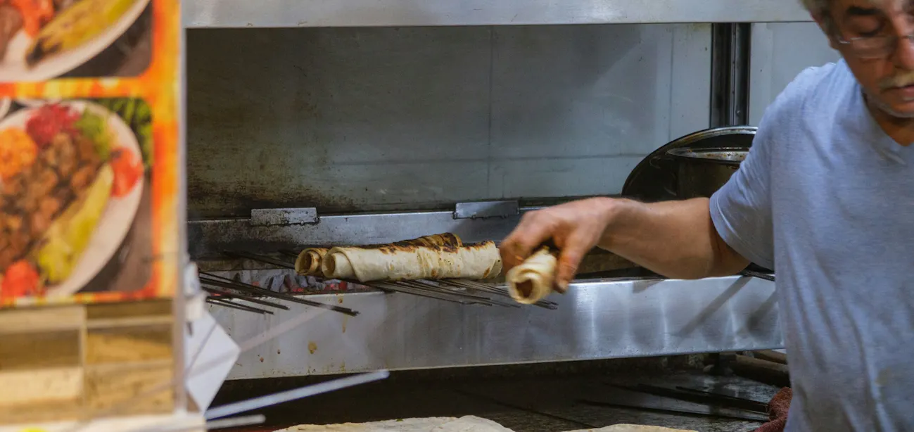 Baker making low glycemic Mediterranean-style pita bread