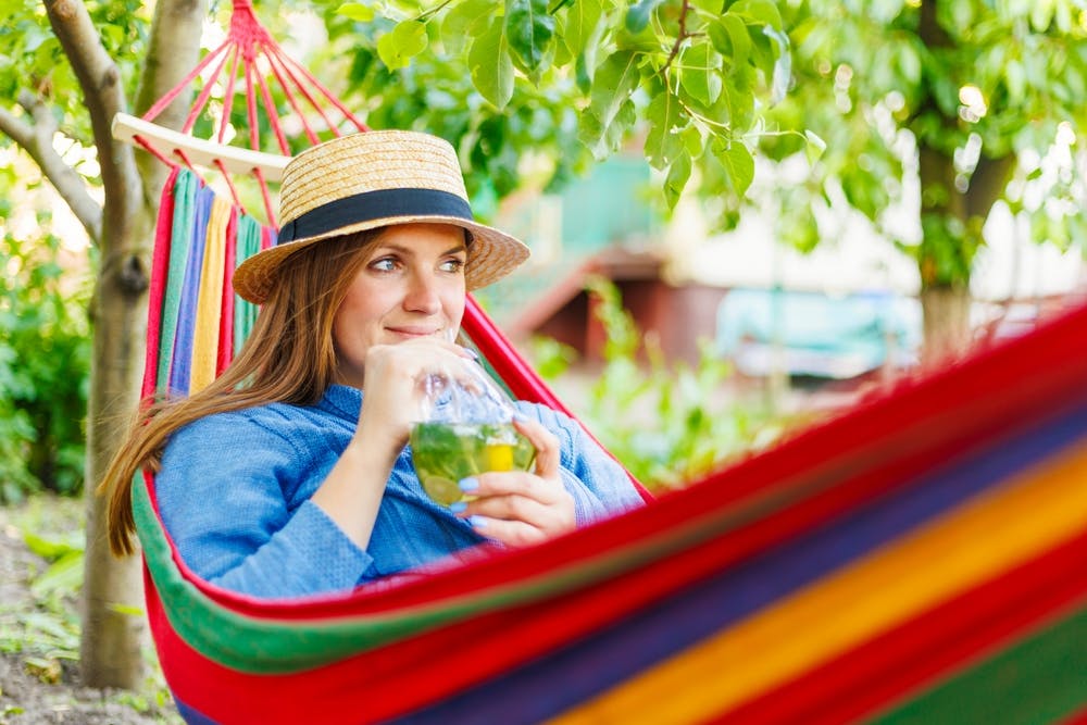 Lady taking iced lemon for it nutritional benefits