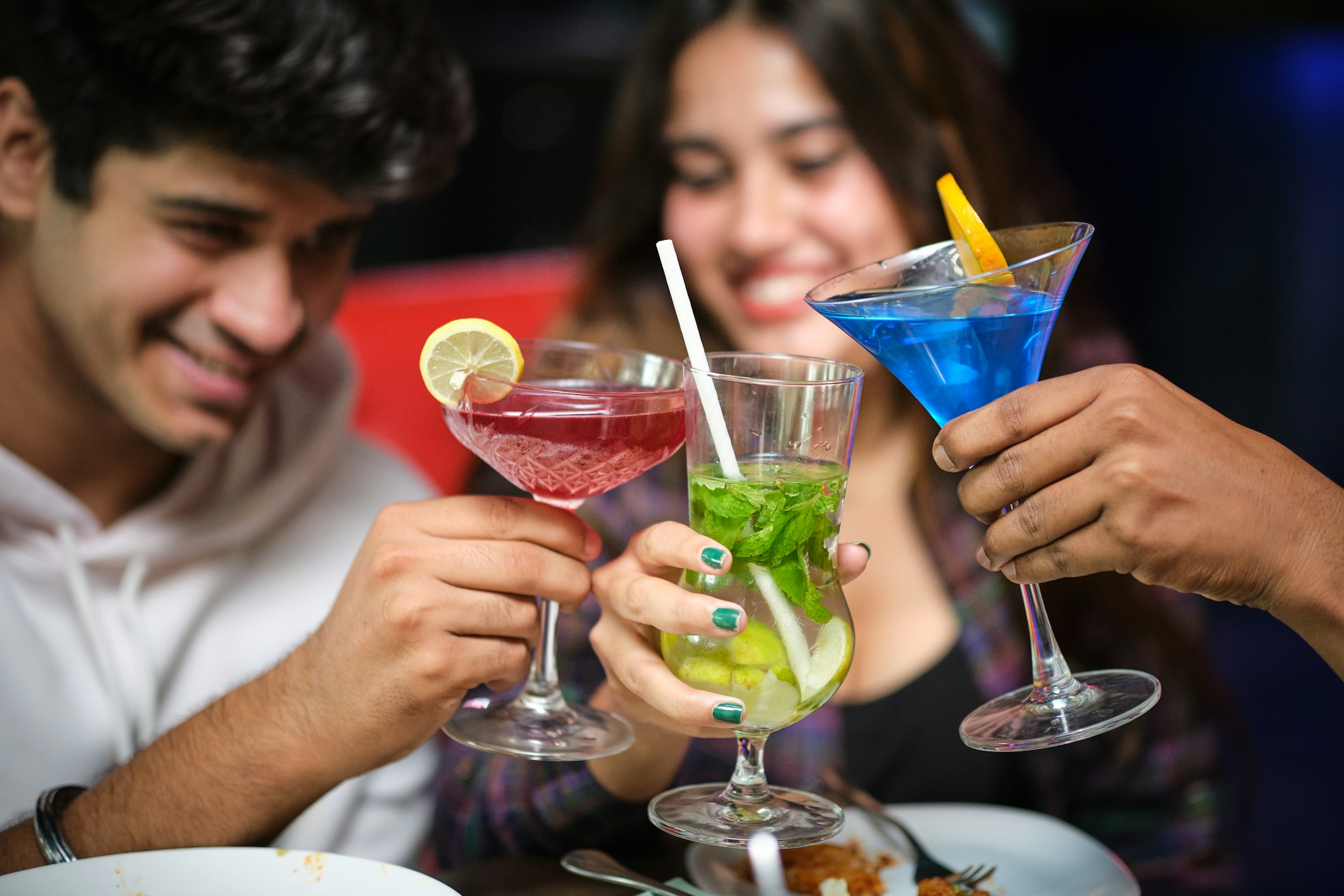 Friends enjoying Low-carb vodka soda with lime in a glass