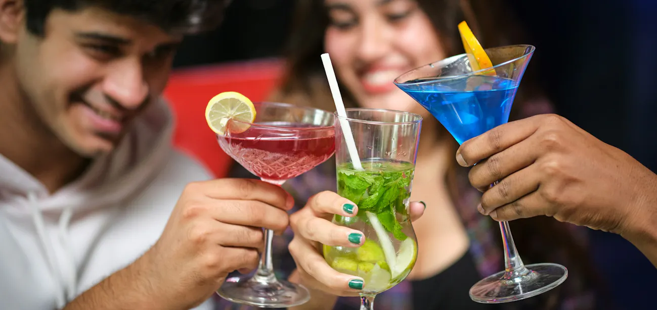 Friends enjoying Low-carb vodka soda with lime in a glass