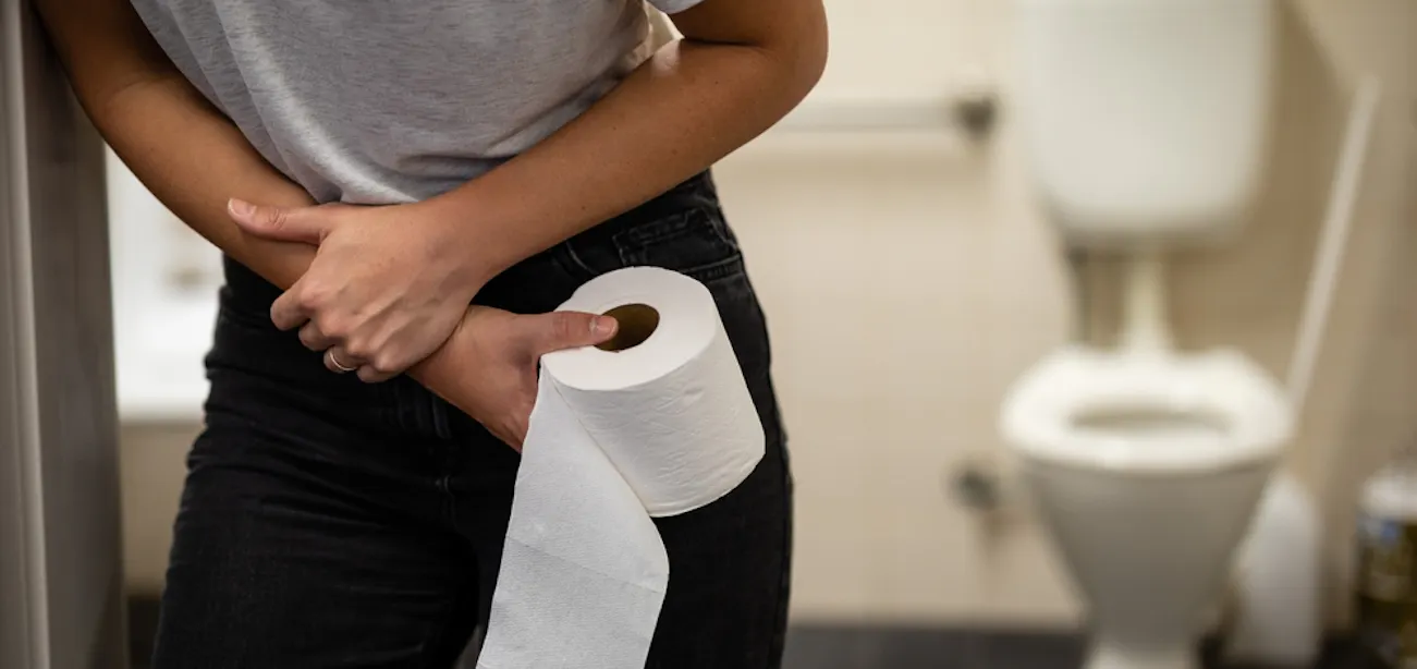 Person with stomach discomfort while on keto diet