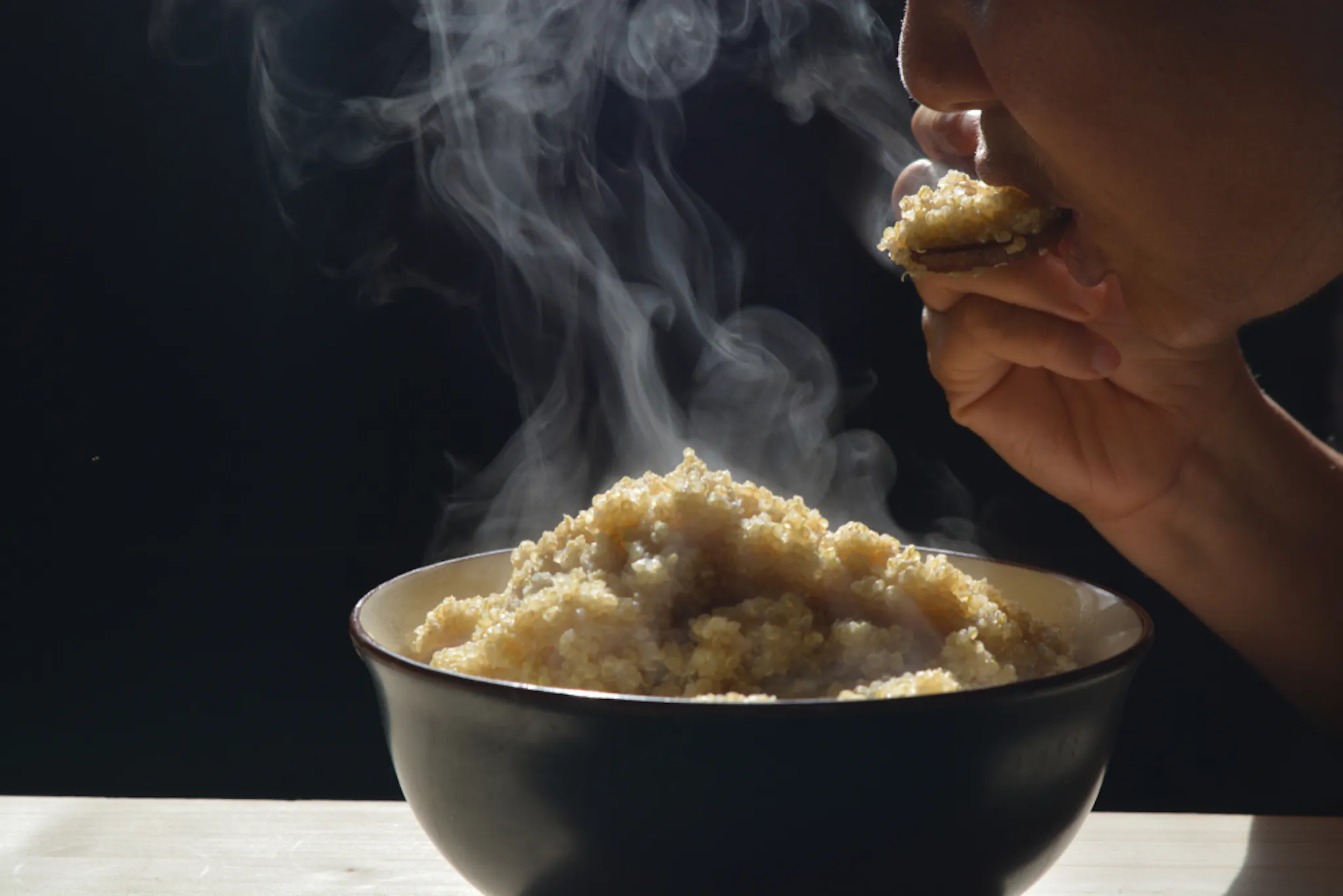 A person eating High-protein quinoa