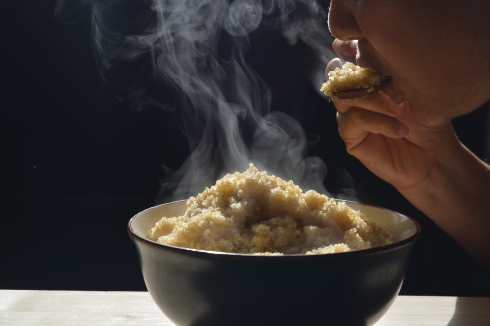 A person eating High-protein quinoa