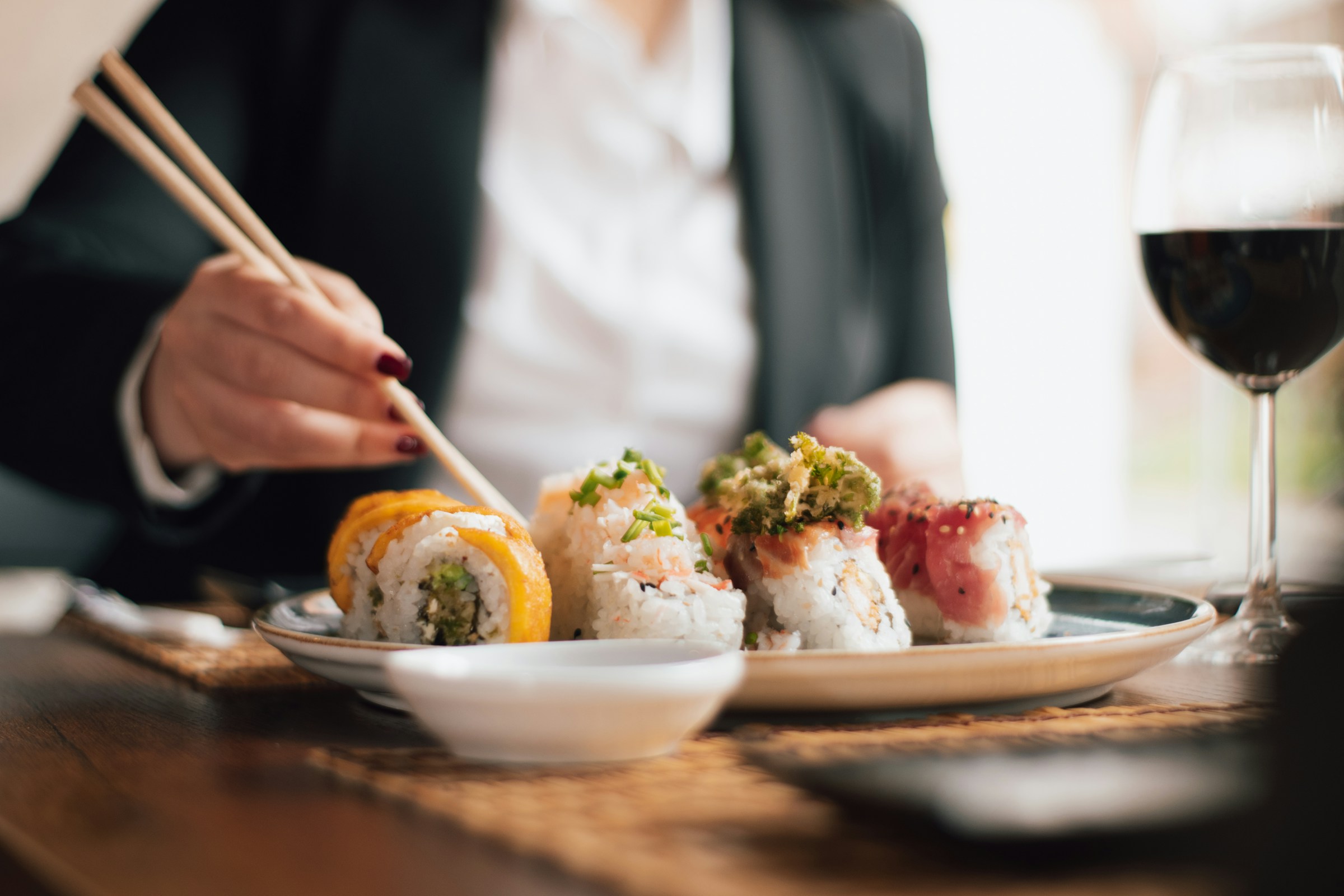 Sushi-grade raw salmon sliced for sashimi