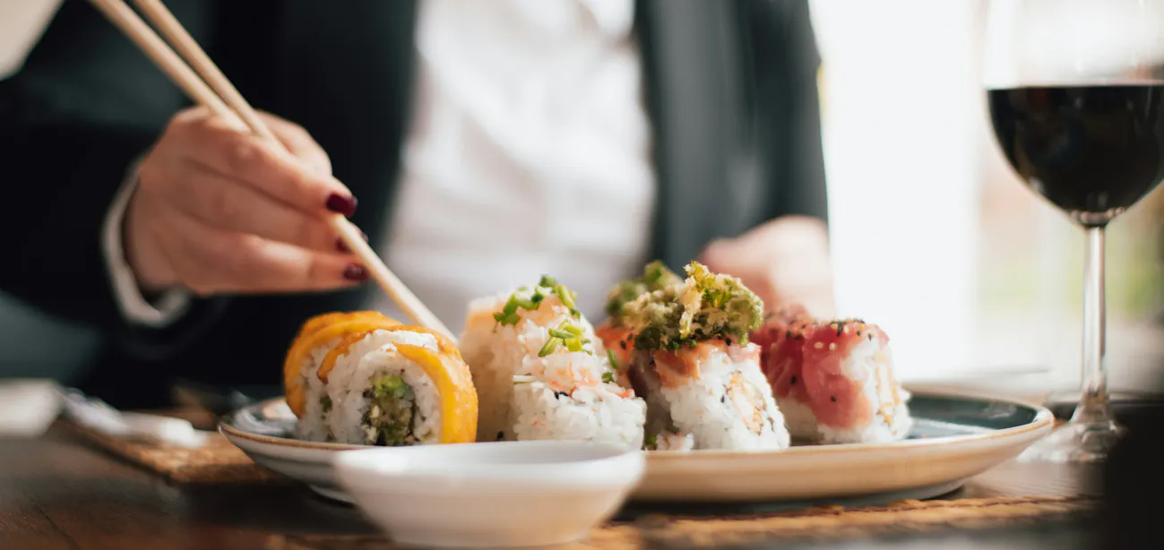 Sushi-grade raw salmon sliced for sashimi
