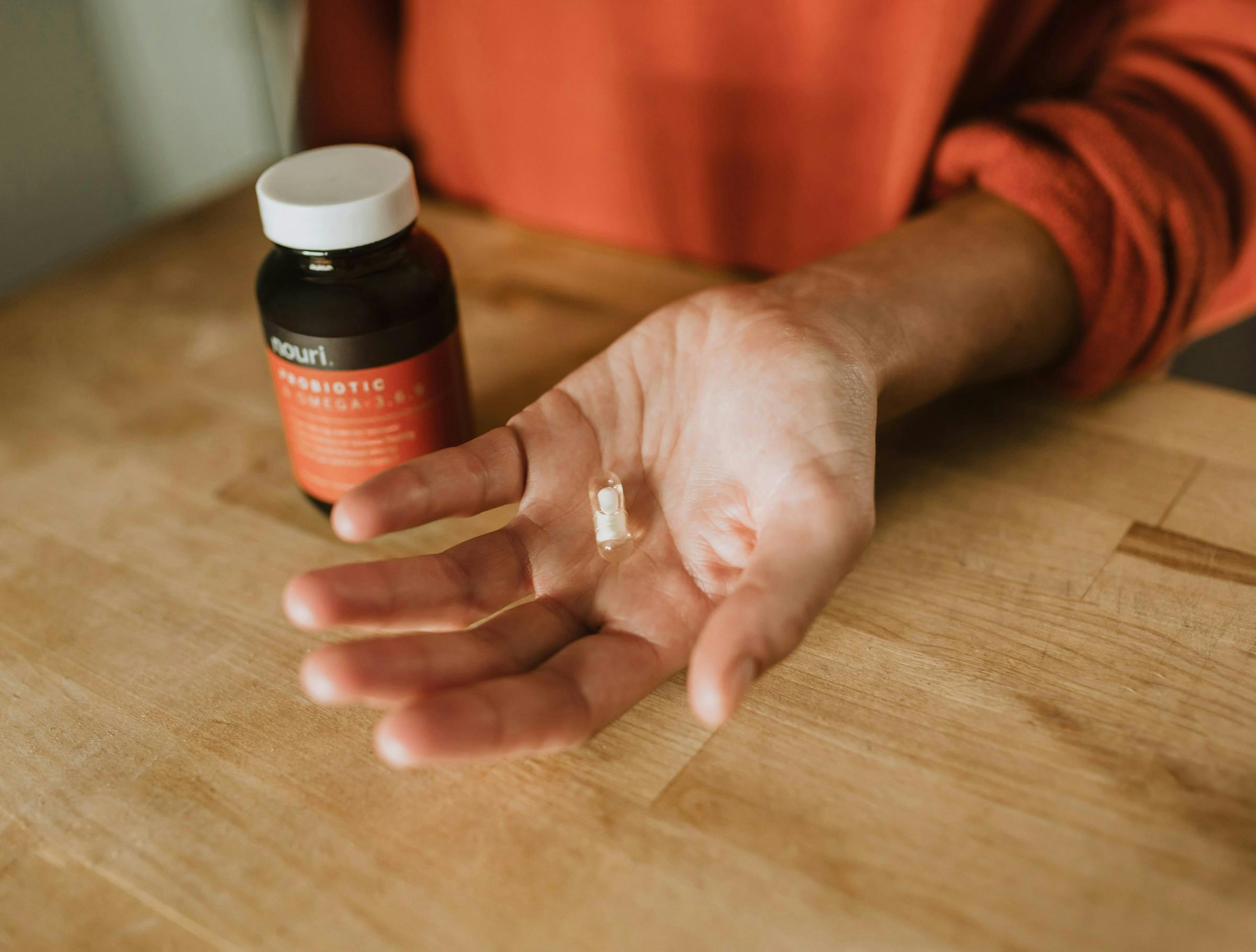 Person considering dosage of melatonin to take
