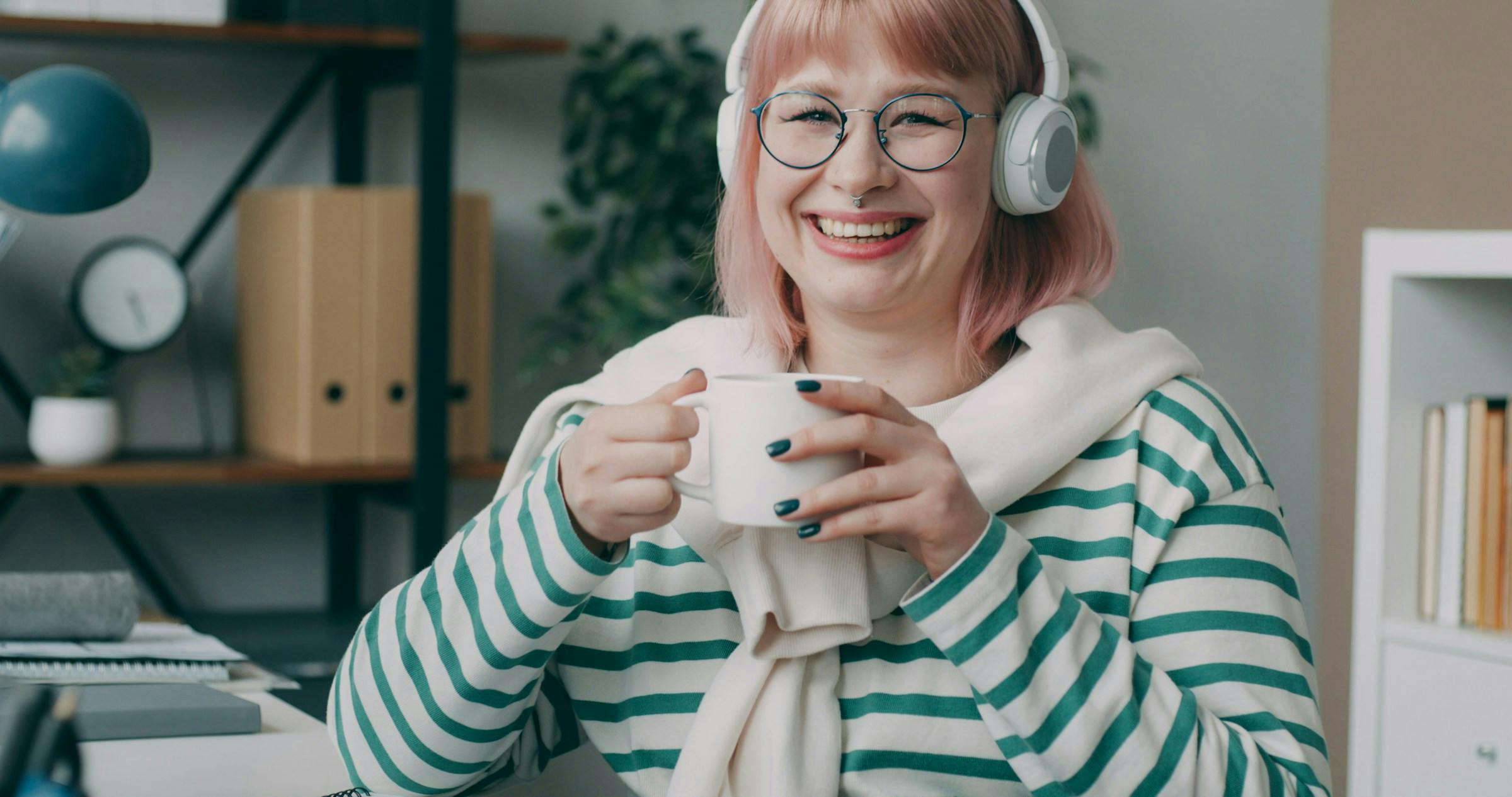 A middle-aged lady in her 40s enjoying tea
