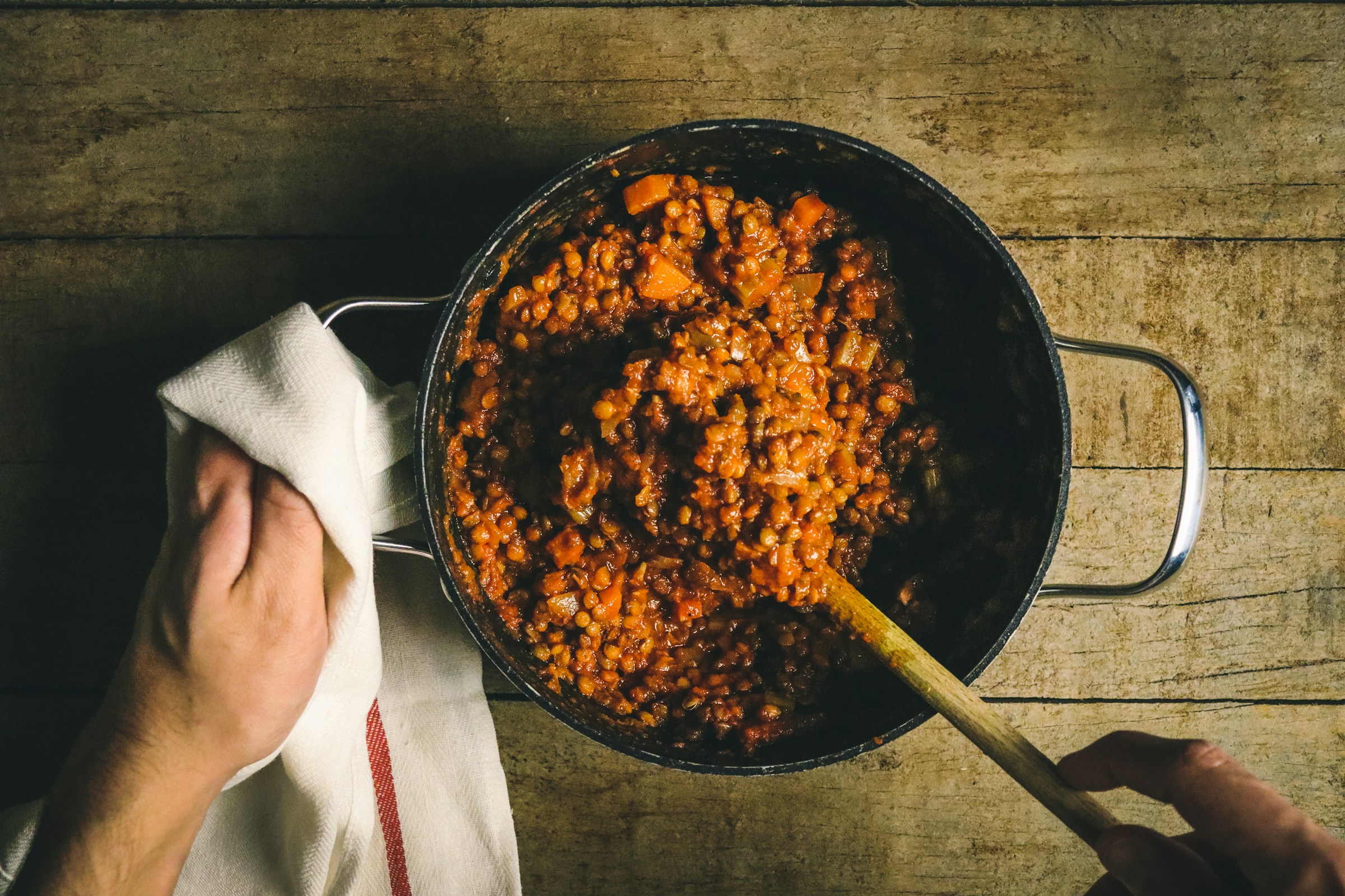 Cooked beans served with leafy greens for gut-soothing support