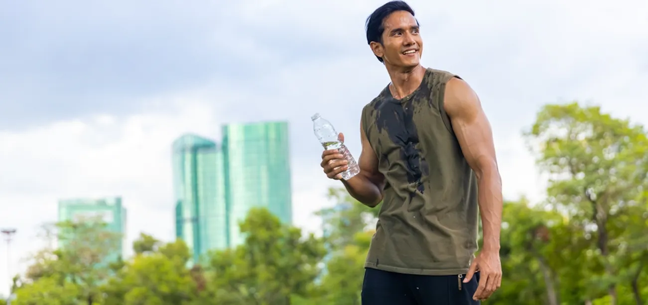 A young man sweating, a sign of high body metabolism