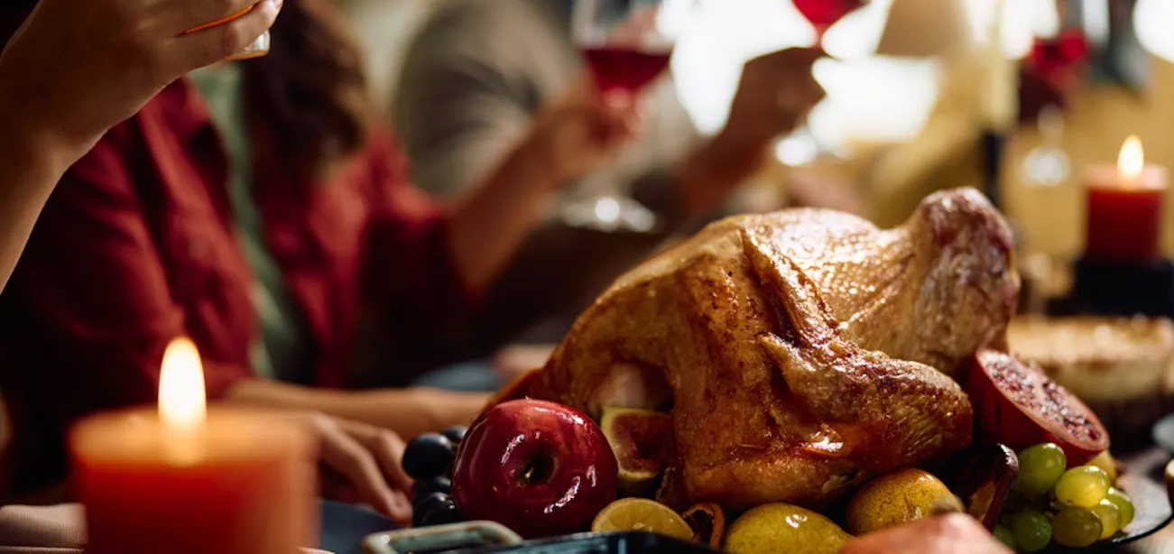 People having a heavy thanksgiving dinner with turkey