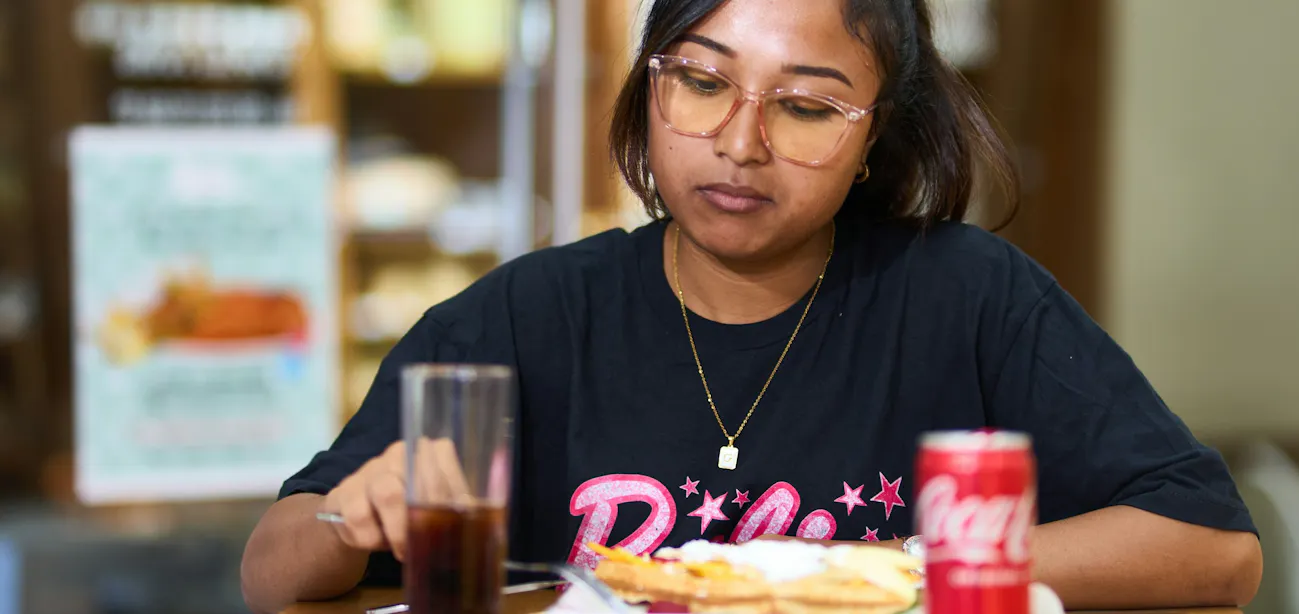 Young lady wondering why she is not losing weight despite eating lesser