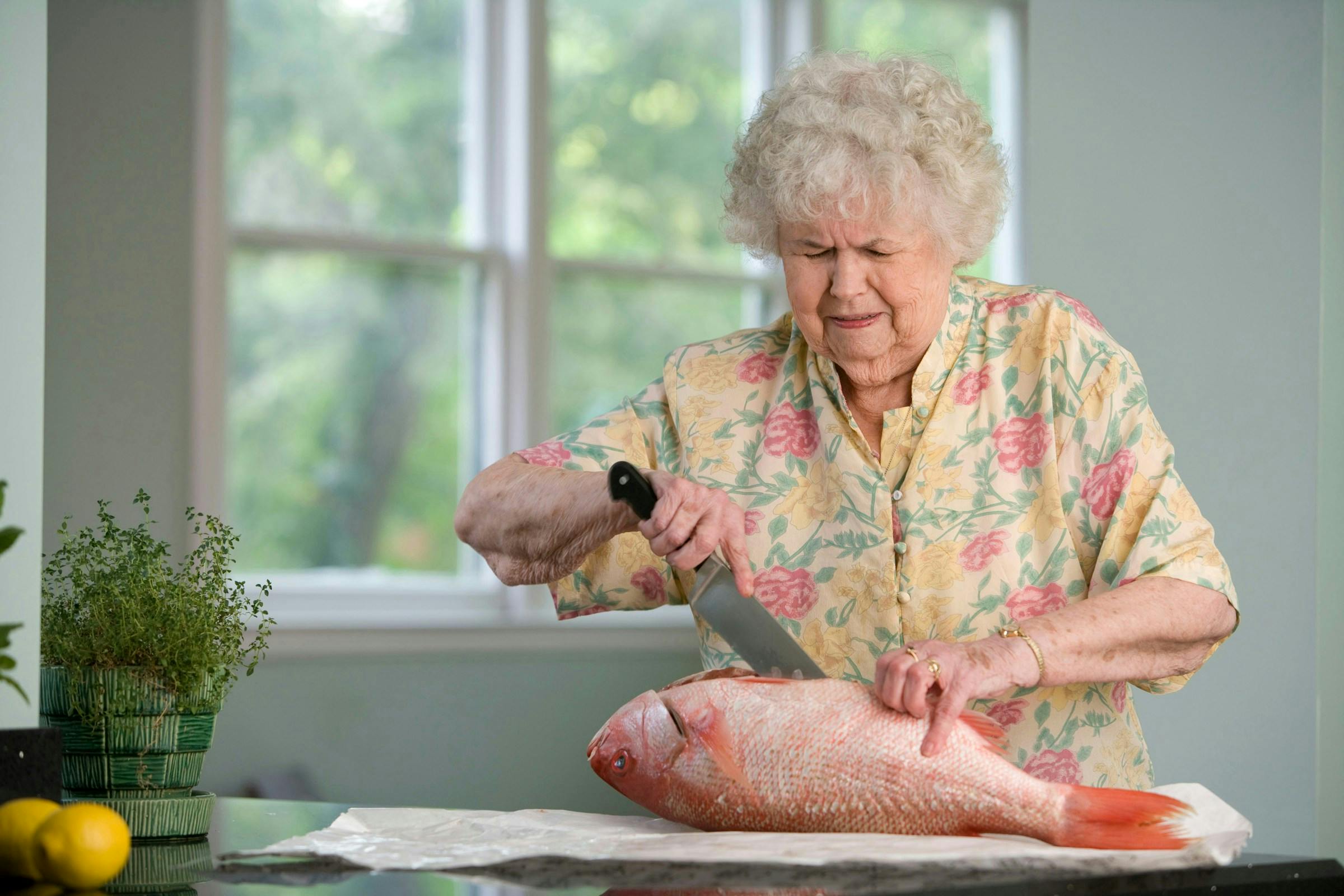 An elderly woman preparing a food that boost collagen production in women