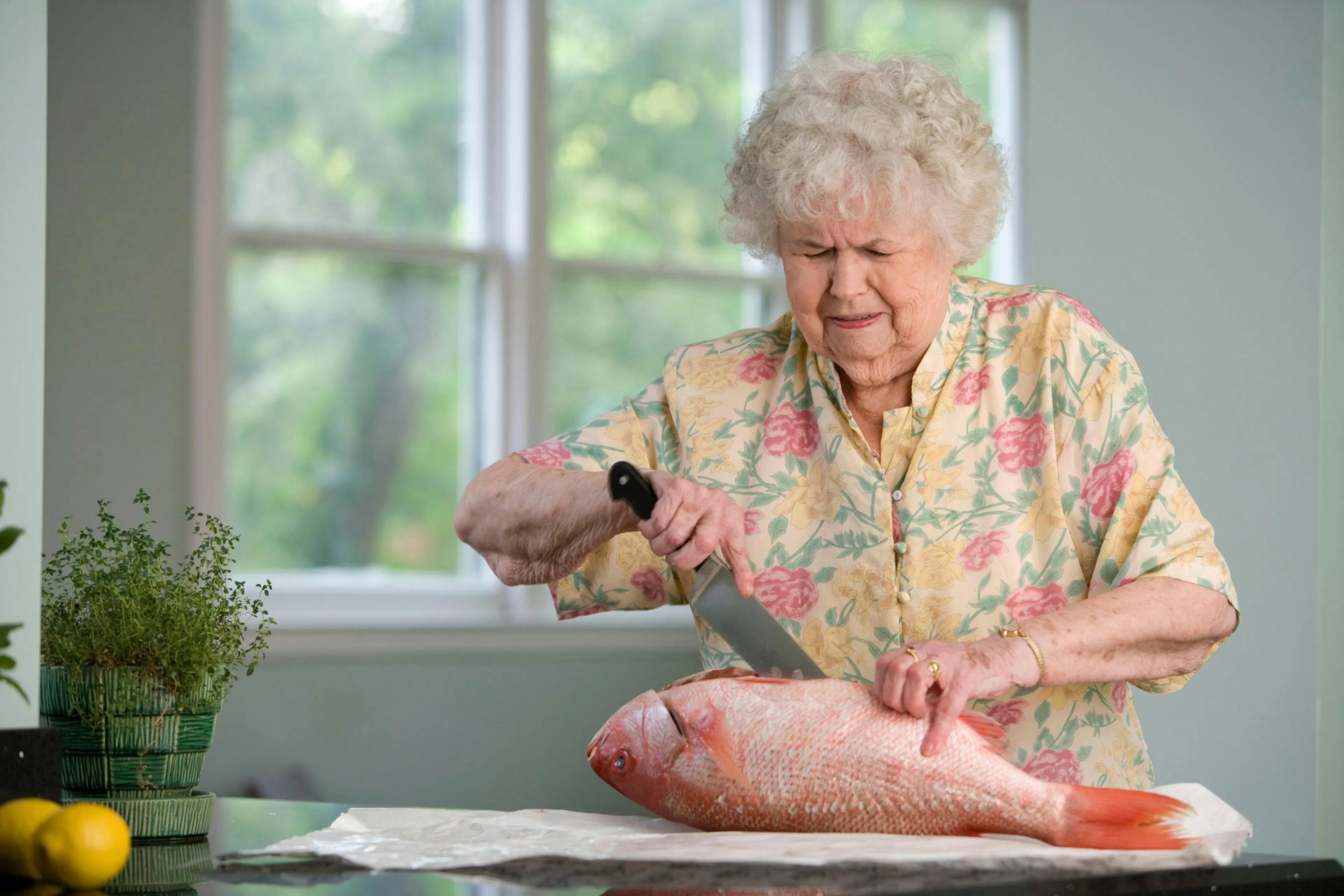An elderly woman preparing a food that boost collagen production in women