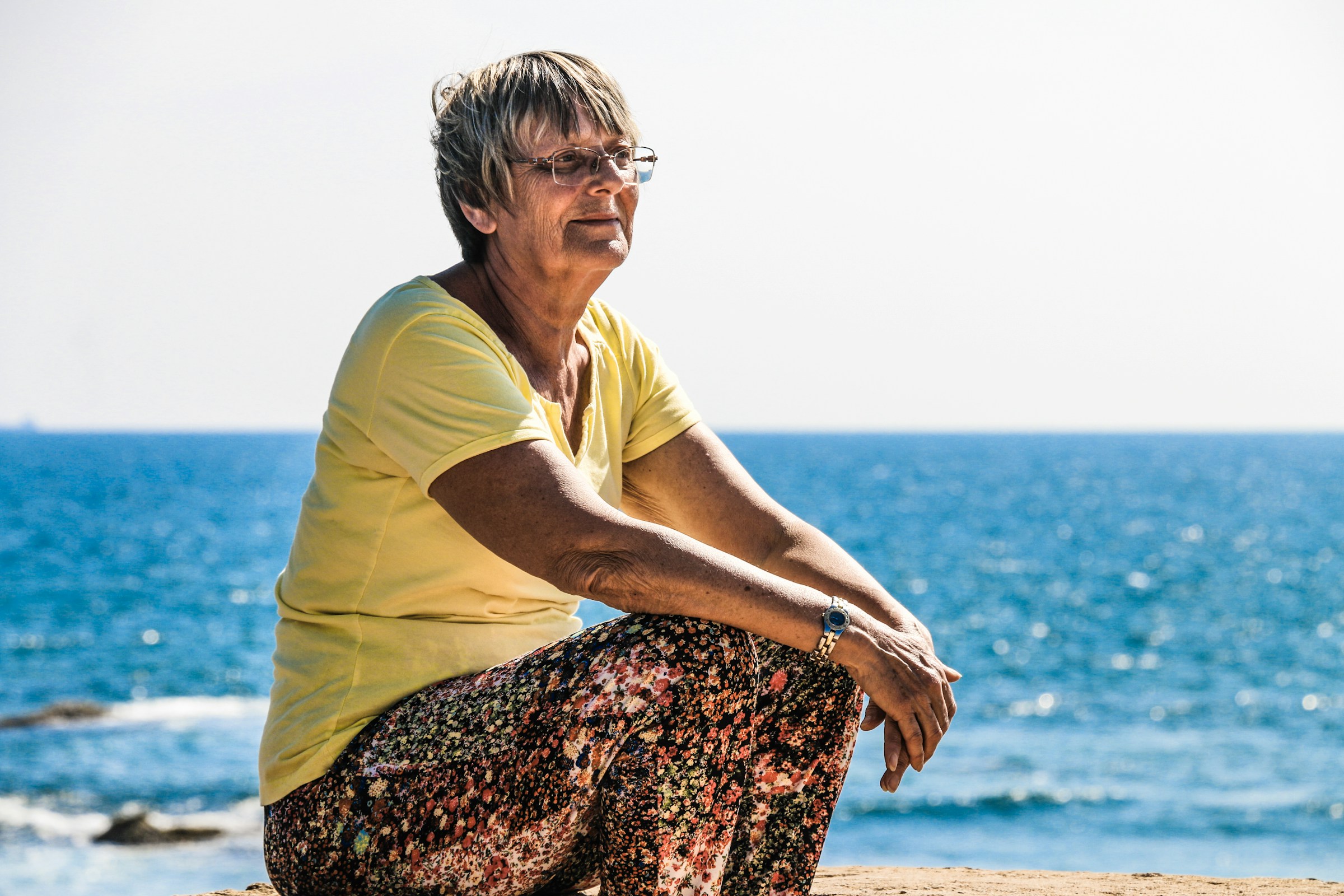 A woman enjoying the beach after menopause collagen skin change