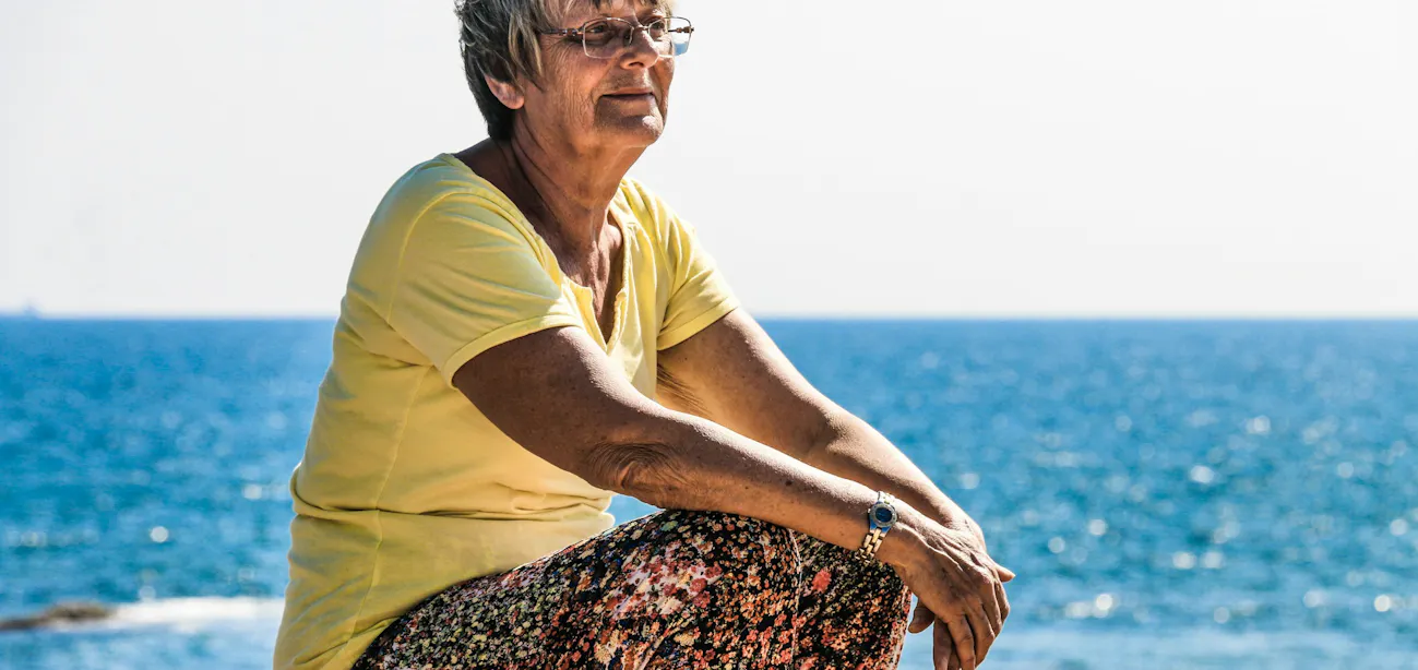 A woman enjoying the beach after menopause collagen skin change