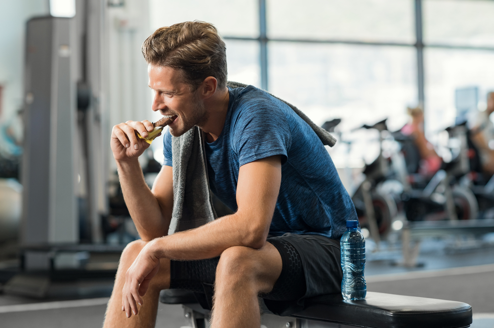 A person taking a Post-workout nutrition for muscle growth