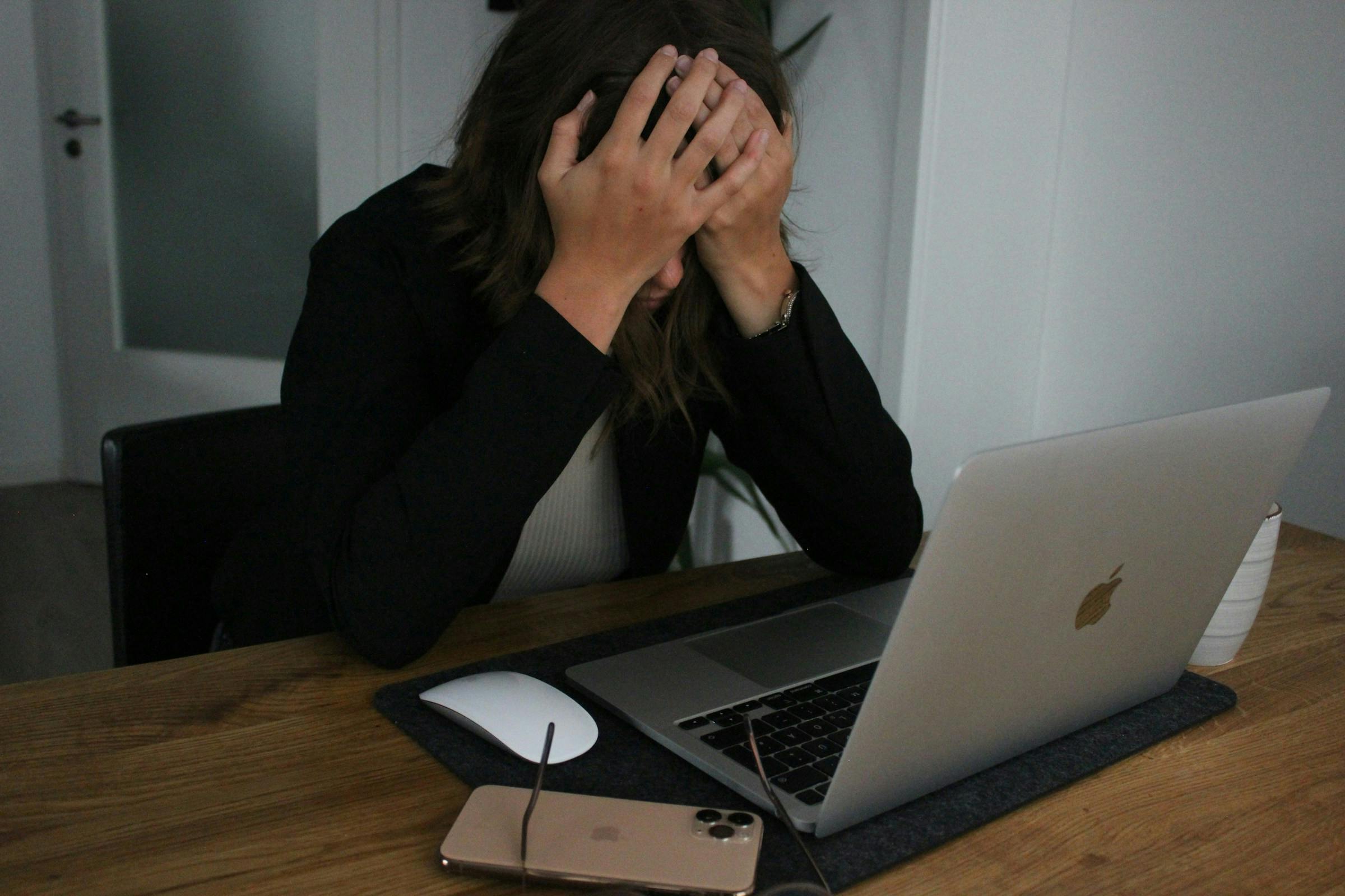 A lady having headache because of lack of meal