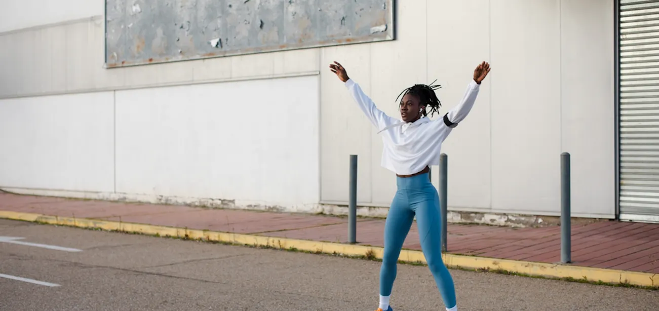 A lady doing jumping jacks
