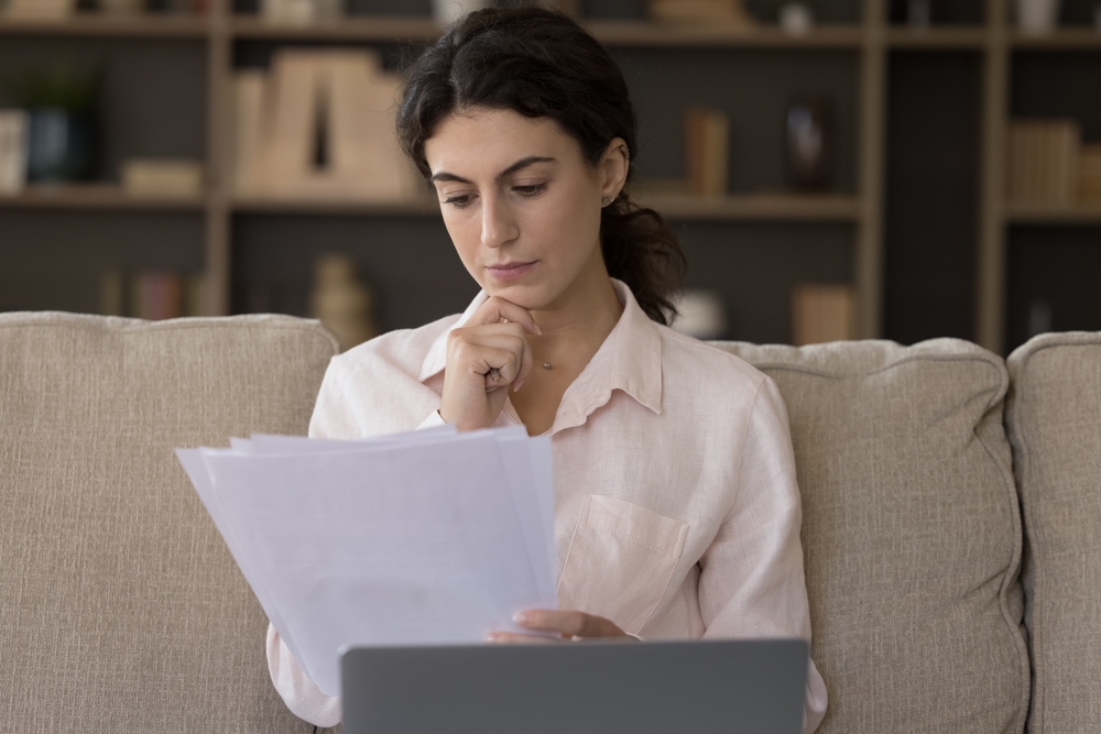 A lady checking her lab results to understand her estradiol levels