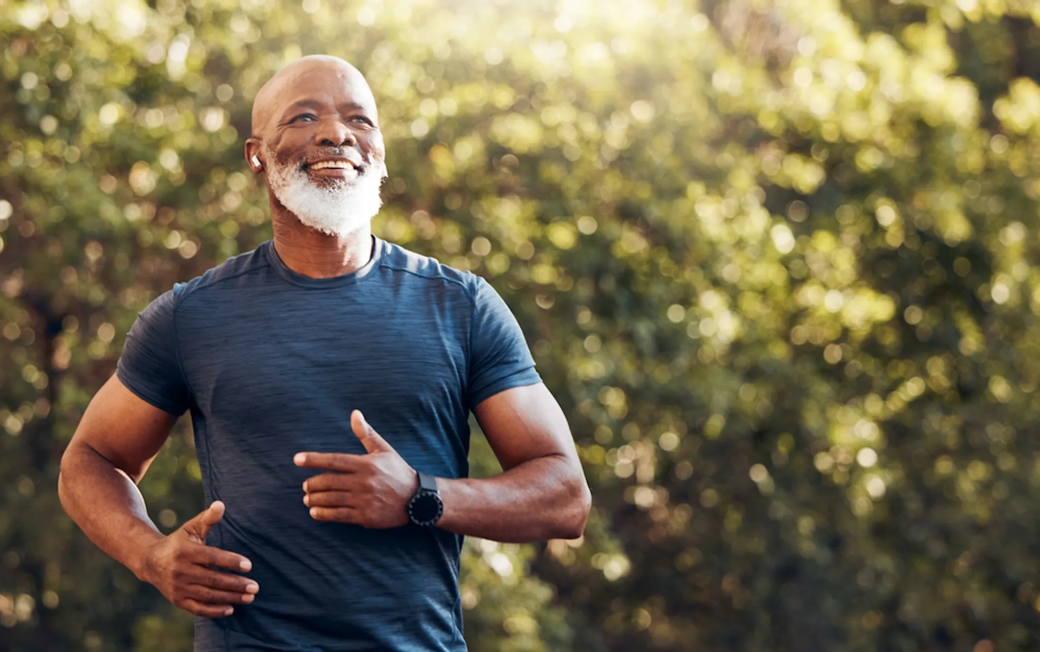 An elderly man actively exercising