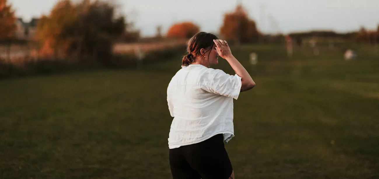 Happy beginner walking outdoors on a weight loss journey