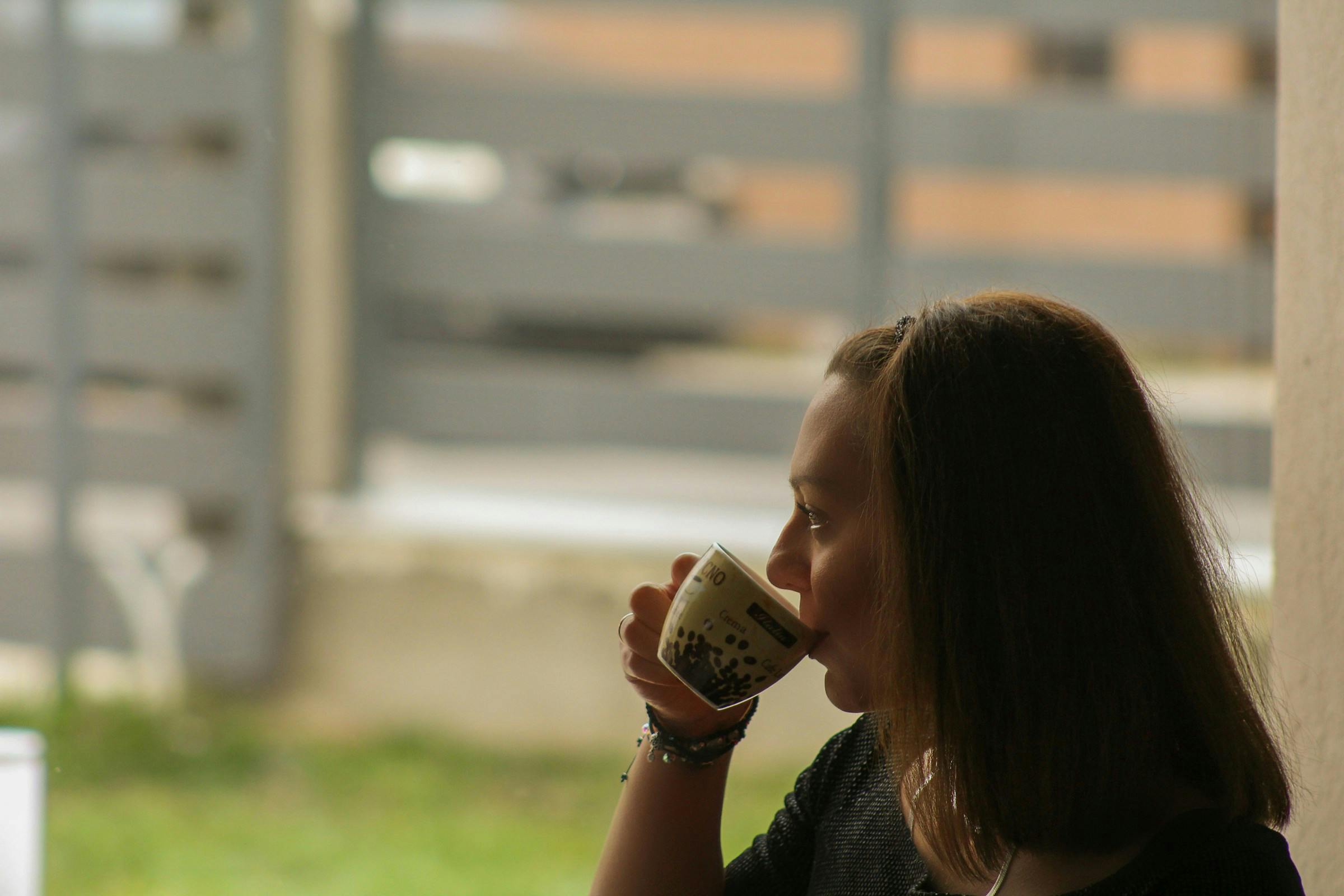 A woman taking Cinnamon tea for blood sugar