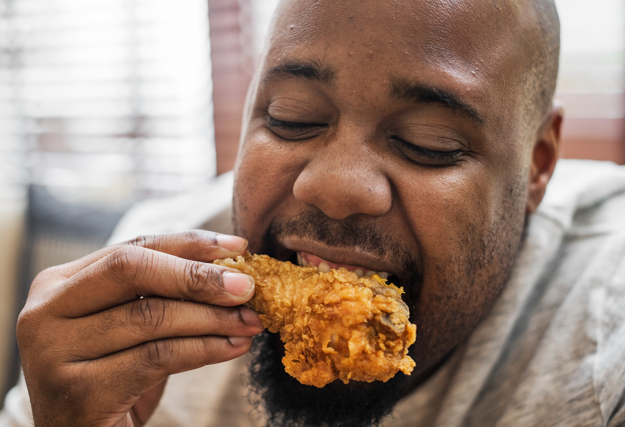 A man eating chicken