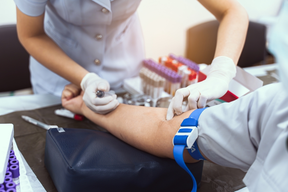 Nurse drawing blood sample to highlight basophil count