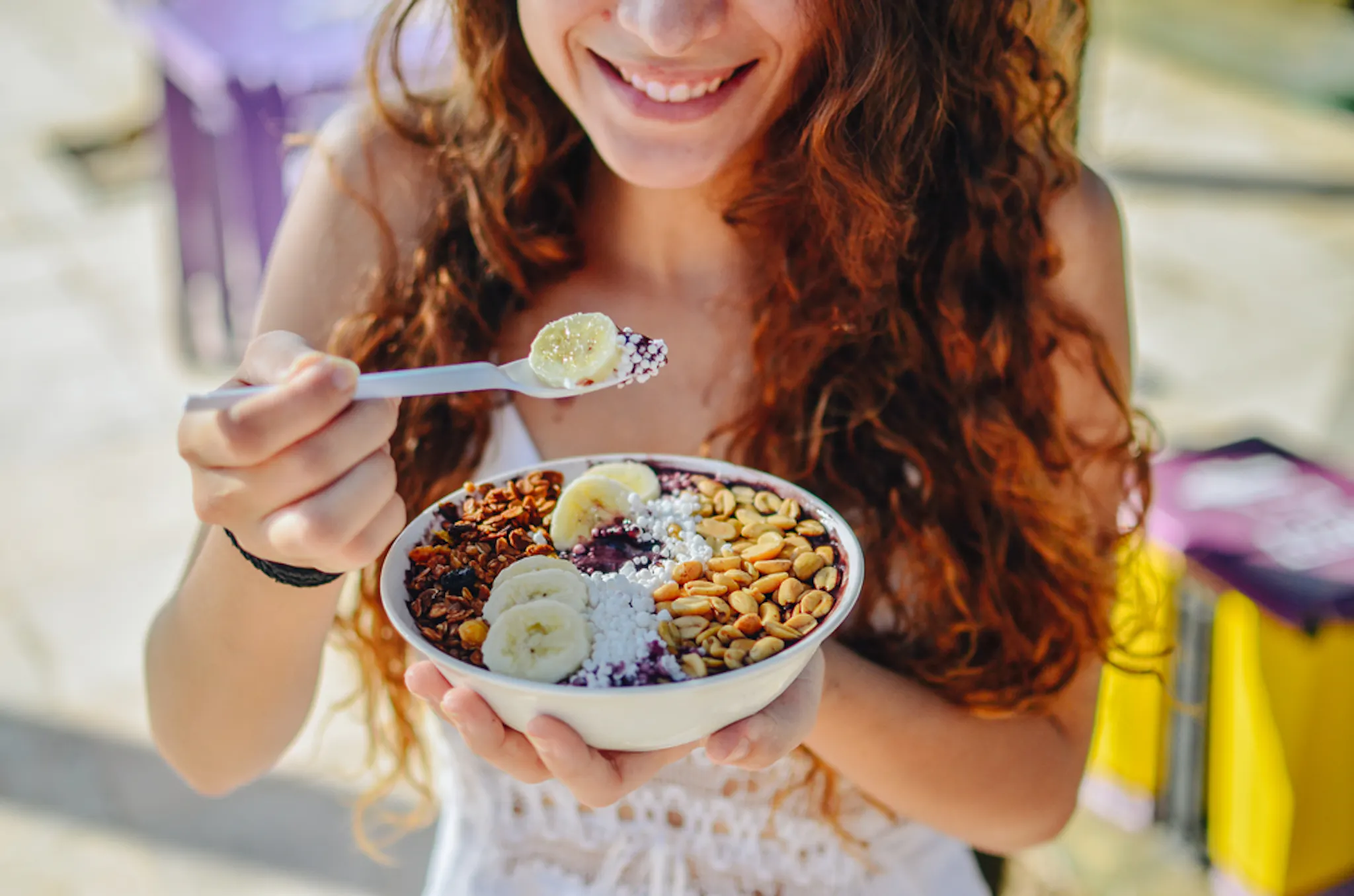 Lady eating vegan keto meal with avocado and tofu